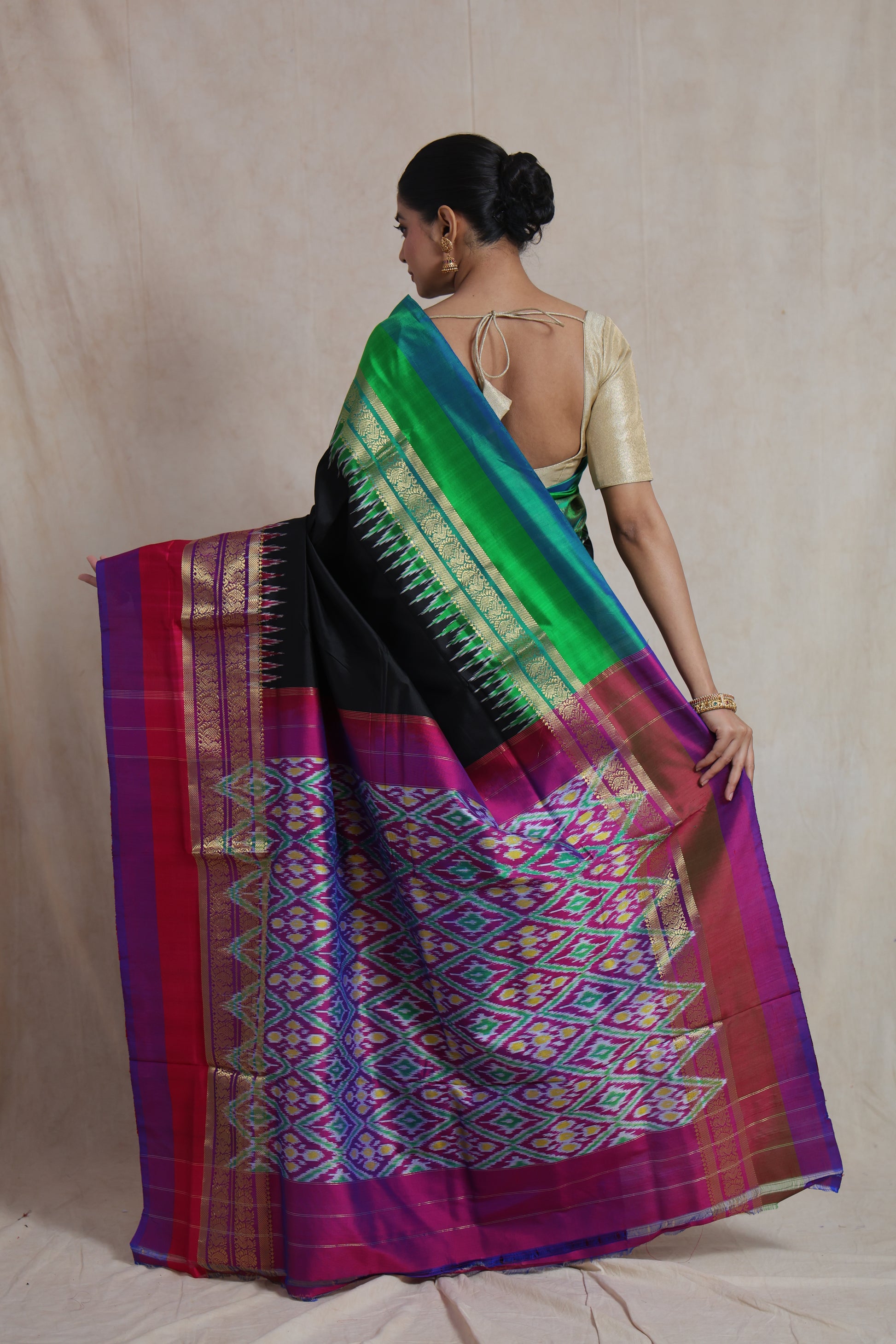 Back drape view of black Panchampali silk saree with green and magenta border