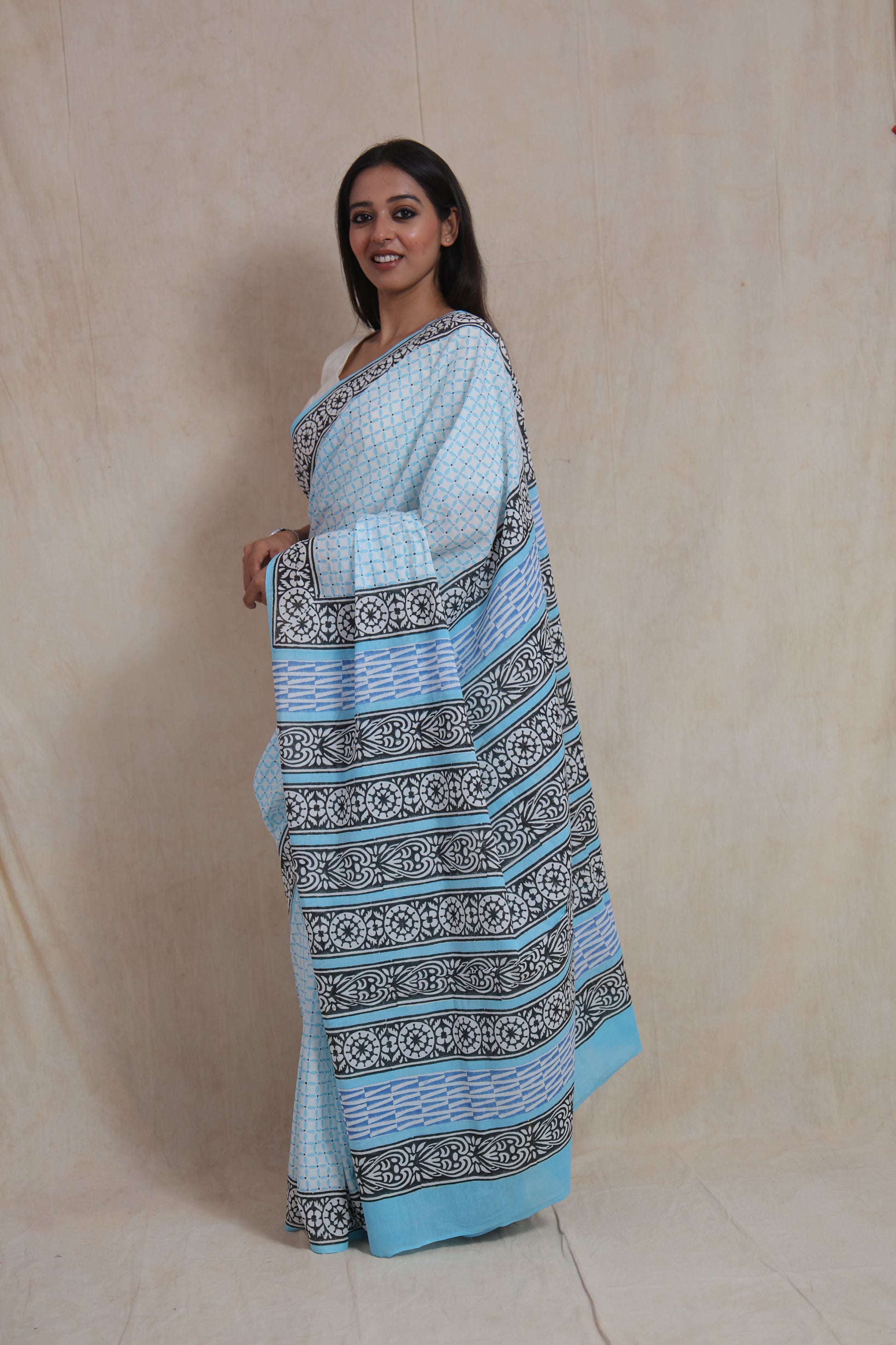 Side view of sky blue Sanghnaree cotton saree with detailed printed pallu