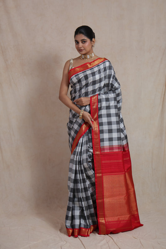 Front view of black and white checked Kanjivaram silk saree with red zari border