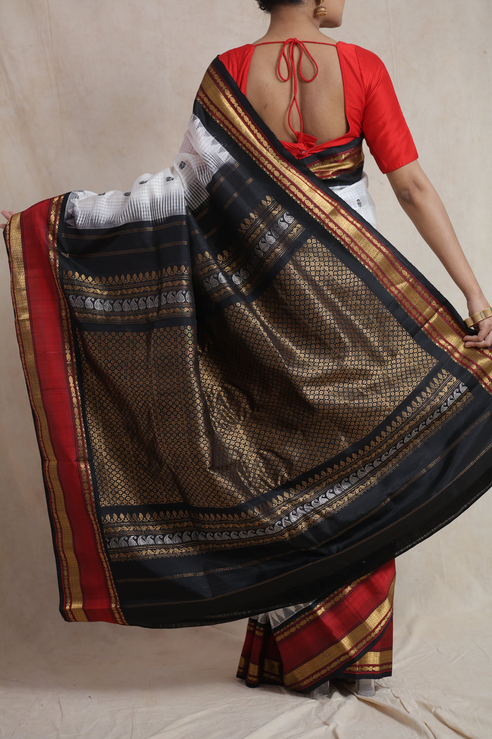 Rich black zari pallu with red border on Gadwal silk saree