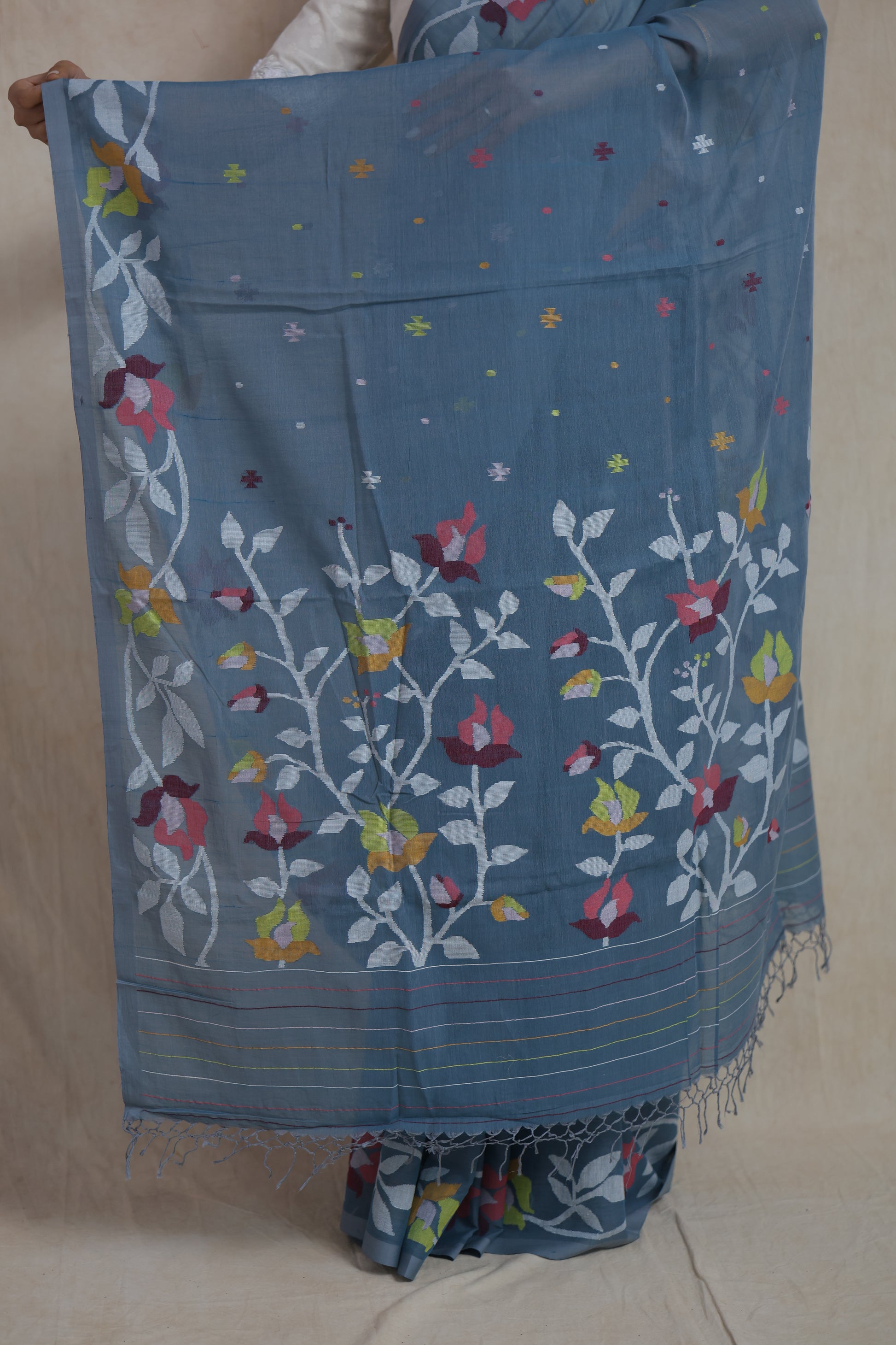 Detailed floral pallu design on dusty blue Bengal Fulia cotton saree