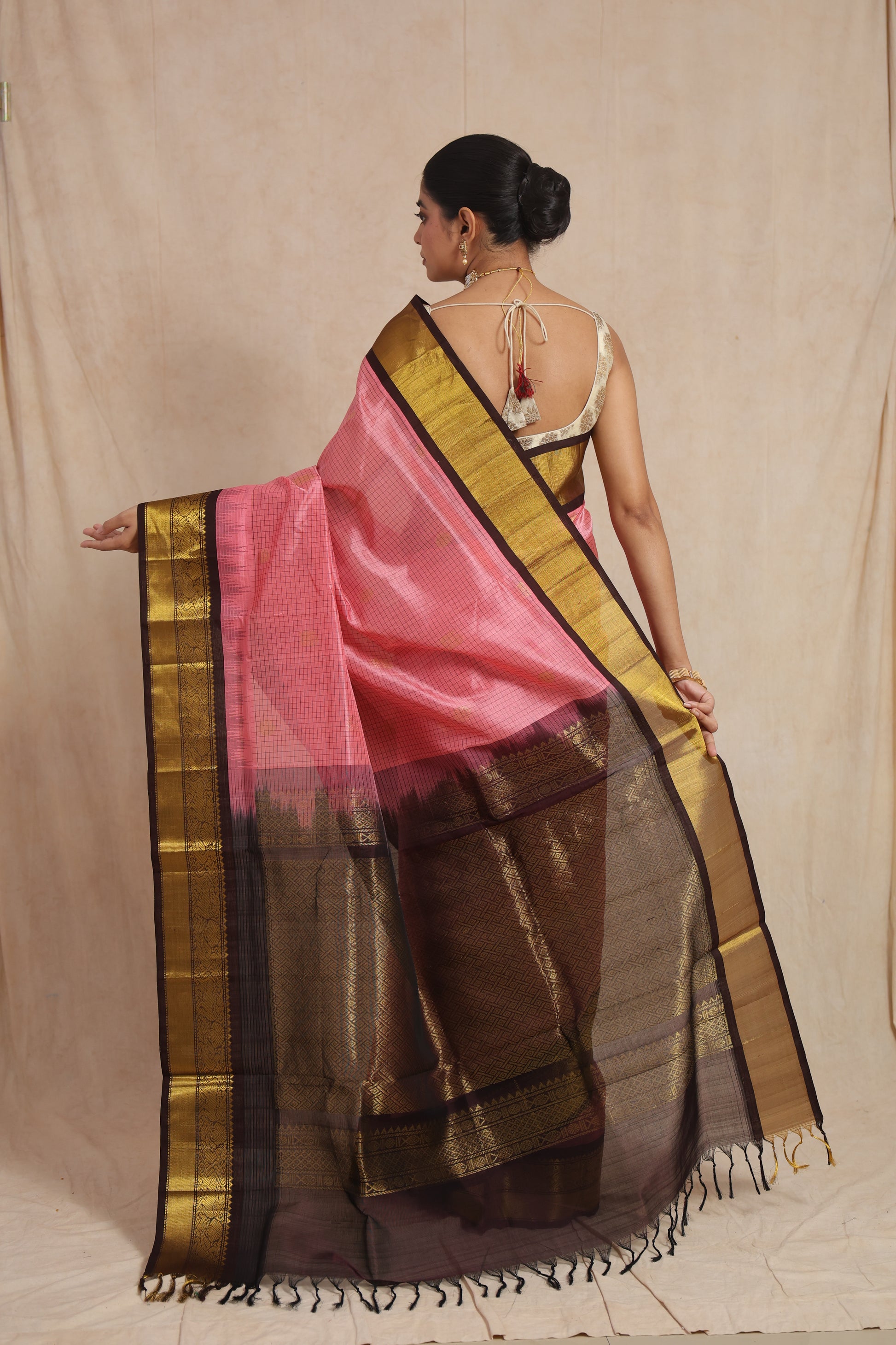 Detailed pallu view of blush pink Kanchipuram Sico saree with antique gold weaving