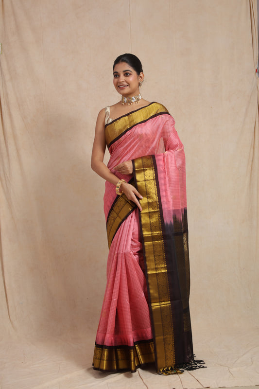 Traditional look featuring blush pink Kanchipuram Sico saree with rich contrast pallu