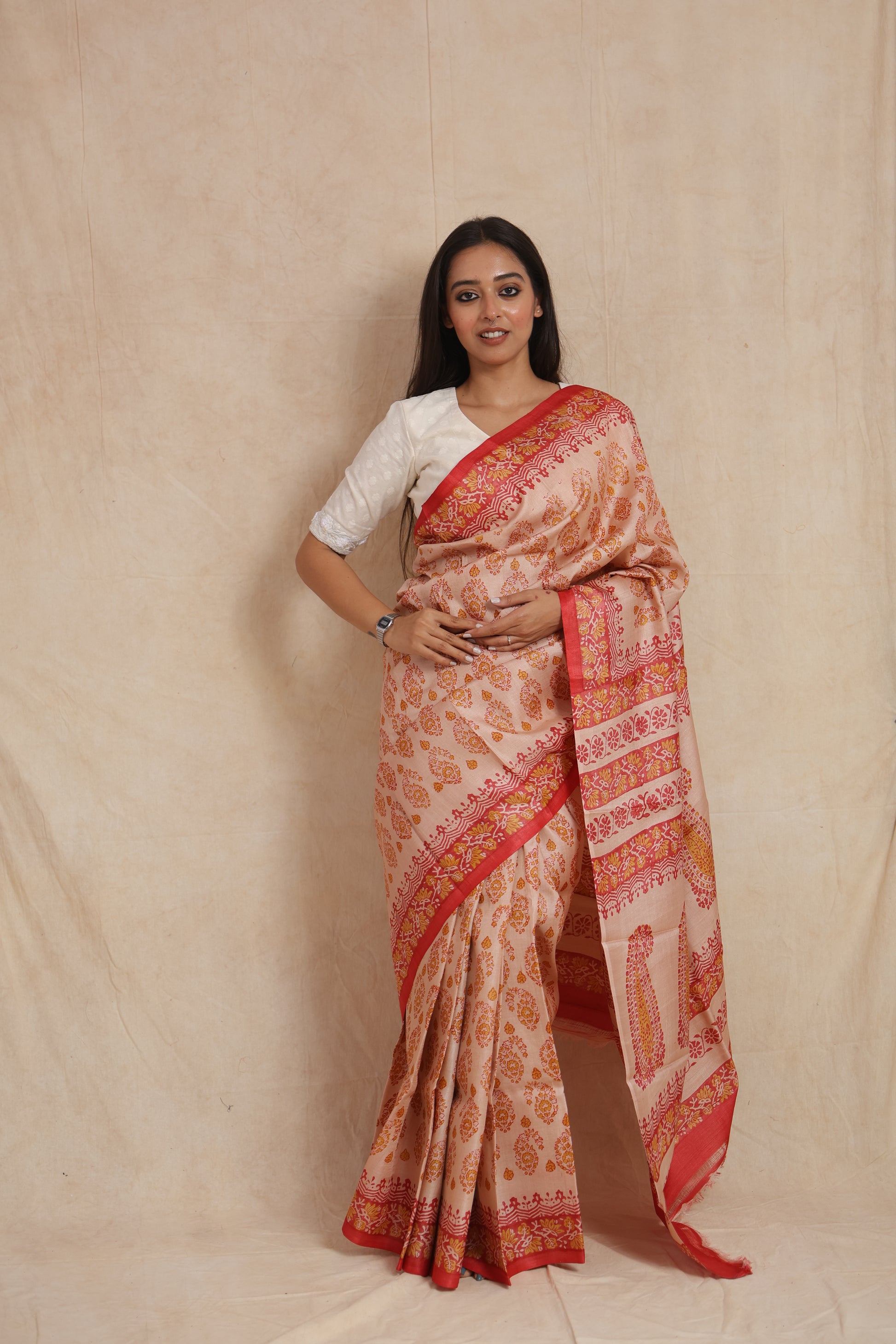 Front drape view of blush pink Batik silk saree with traditional printed pallu