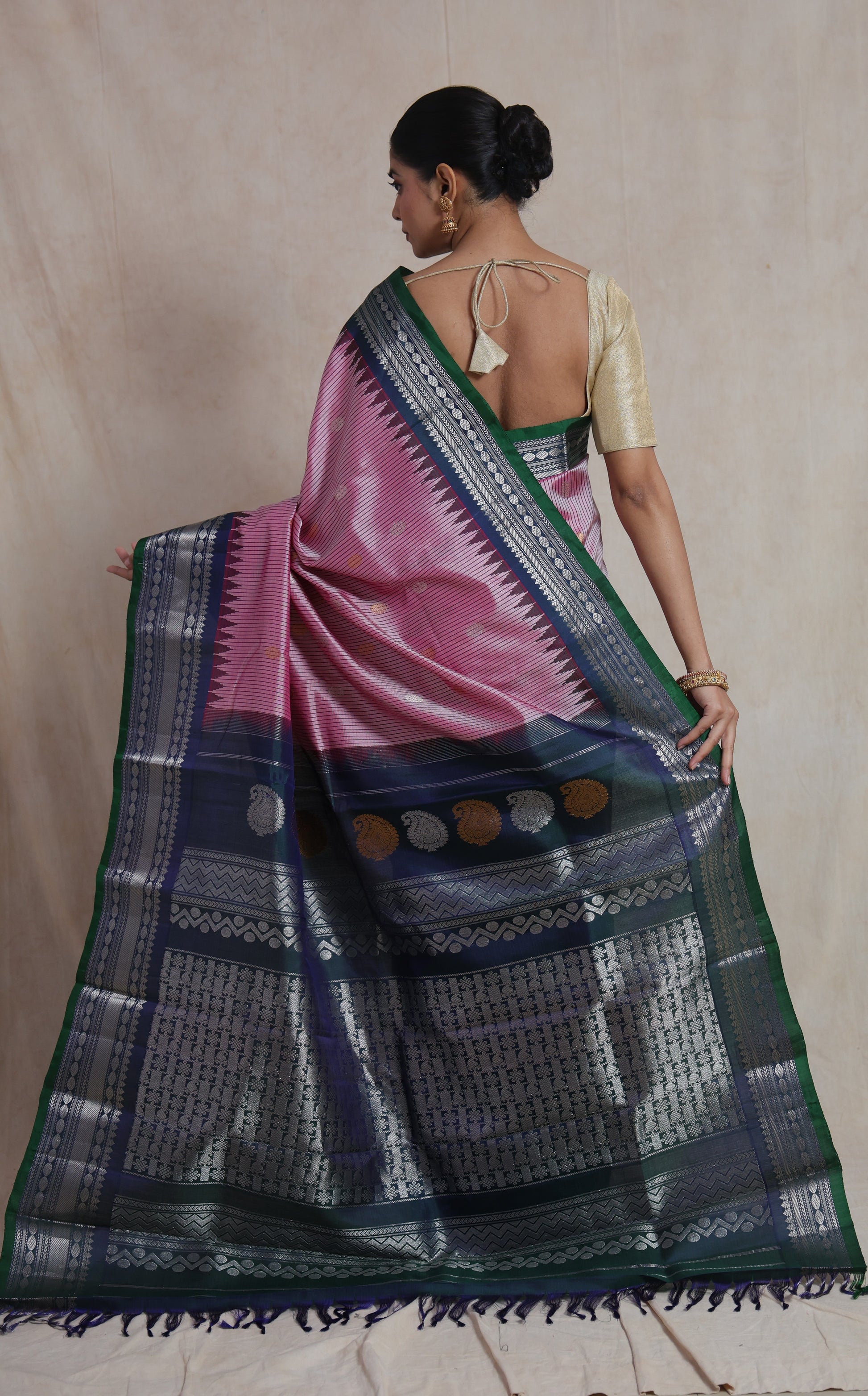 Back view of blush pink Gadwal Silk saree with silver woven pallu and contrast border