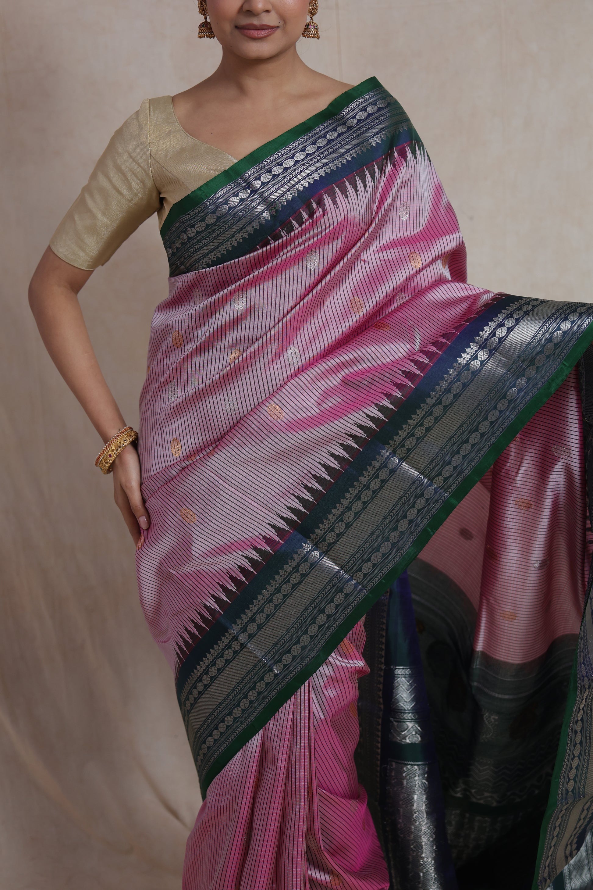 Close-up front look of blush pink Gadwal Silk saree with fine woven stripe detailing