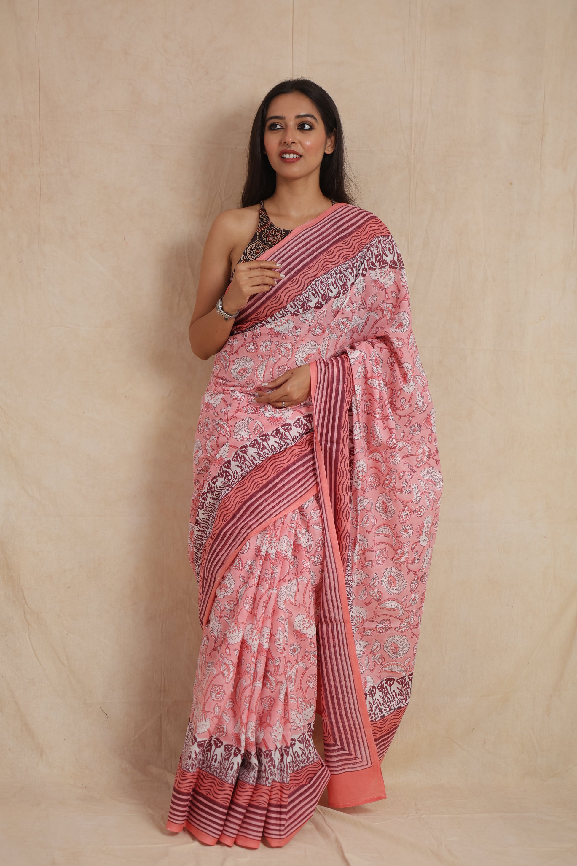 Full drape look of blush pink Sanghnaree cotton saree with elegant striped border