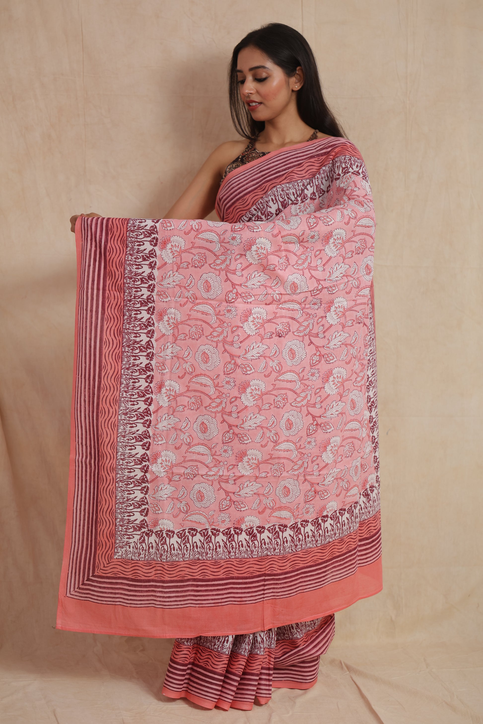 Open pallu presentation of blush pink floral Sanghnaree cotton saree