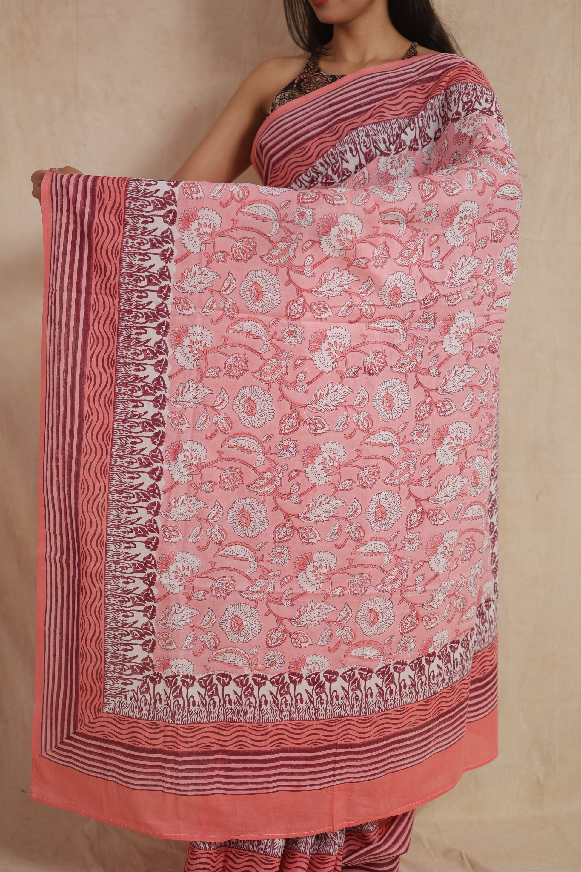 Detailed pallu view of blush pink Sanghnaree cotton saree with floral motifs