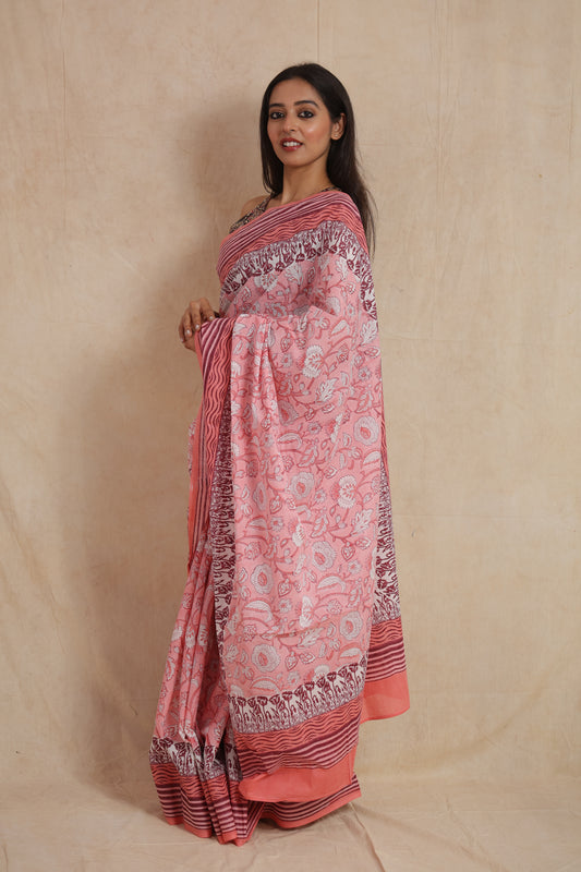 Side profile of blush pink floral Sanghnaree cotton saree with maroon striped border