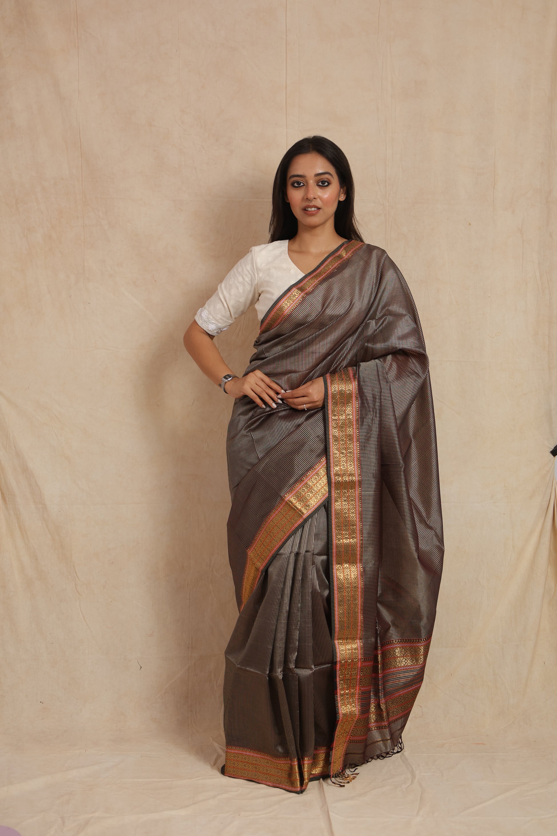 Front view of charcoal Maheshwari silk cotton saree with woven border