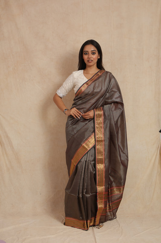 Front view of charcoal Maheshwari silk cotton saree with woven border