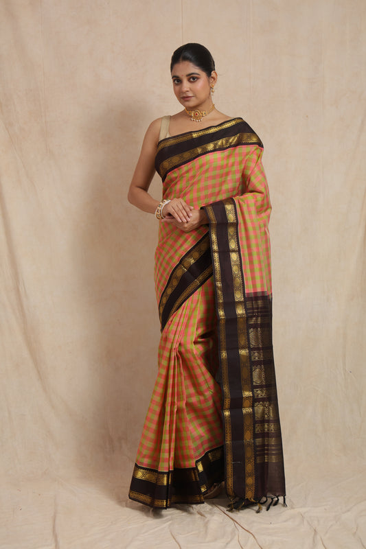 Full view of pastel pink and olive checked Kanchipuram Sico saree with black border