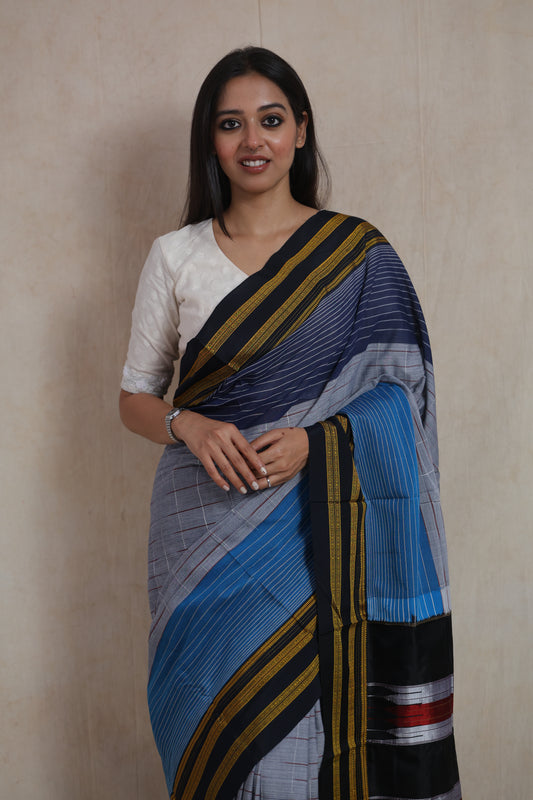 Front view of grey Ilkal handloom cotton saree with indigo blue border and woven detailing