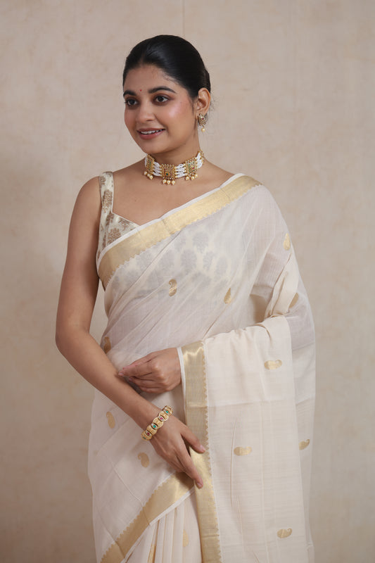 Full look of elegant off white Kanchipuram cotton saree with traditional golden border