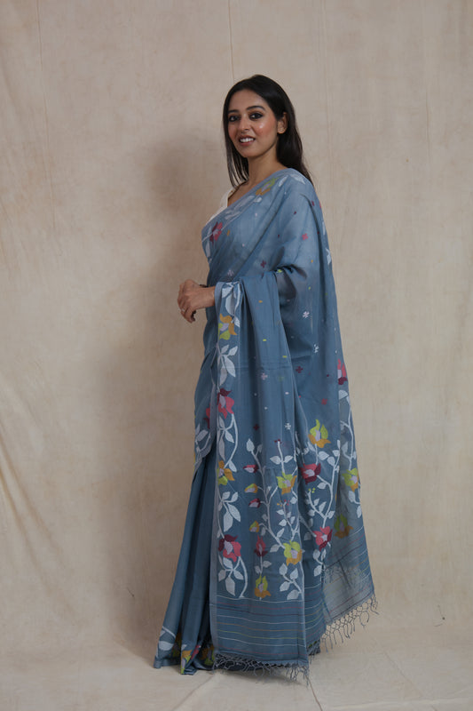 Dusty blue Bengal Fulia cotton saree with floral woven border and elegant drape