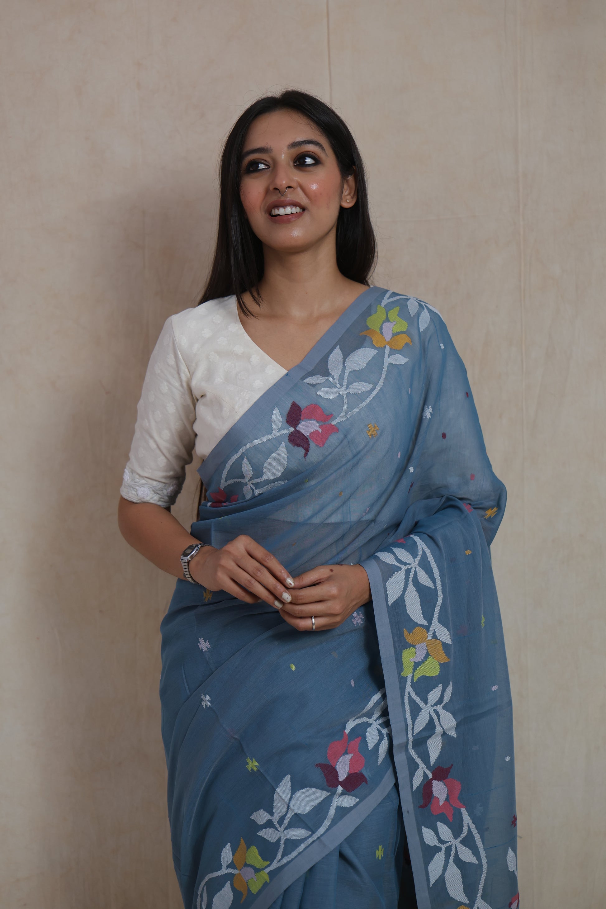 Elegant dusty blue Bengal Fulia cotton saree with soft floral woven detailing