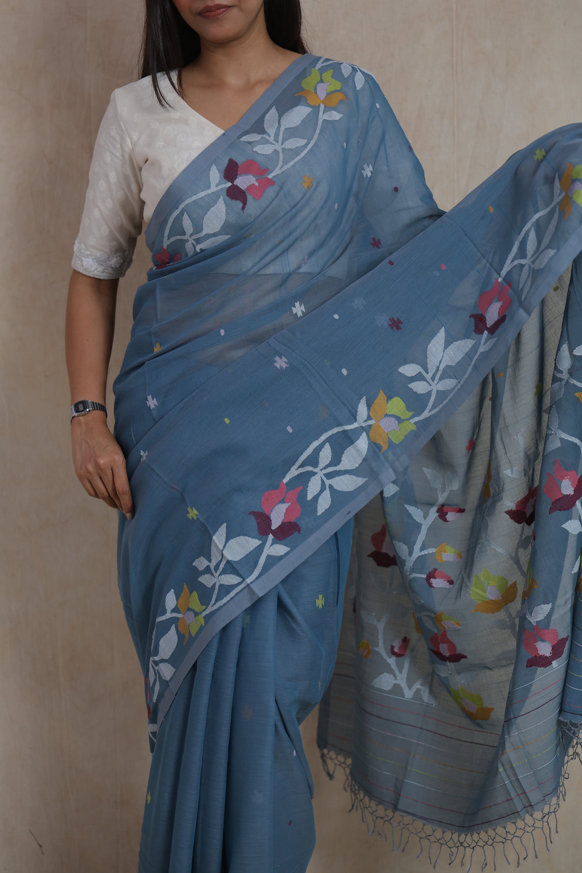 Close-up of Bengal Fulia cotton saree with colourful floral woven border