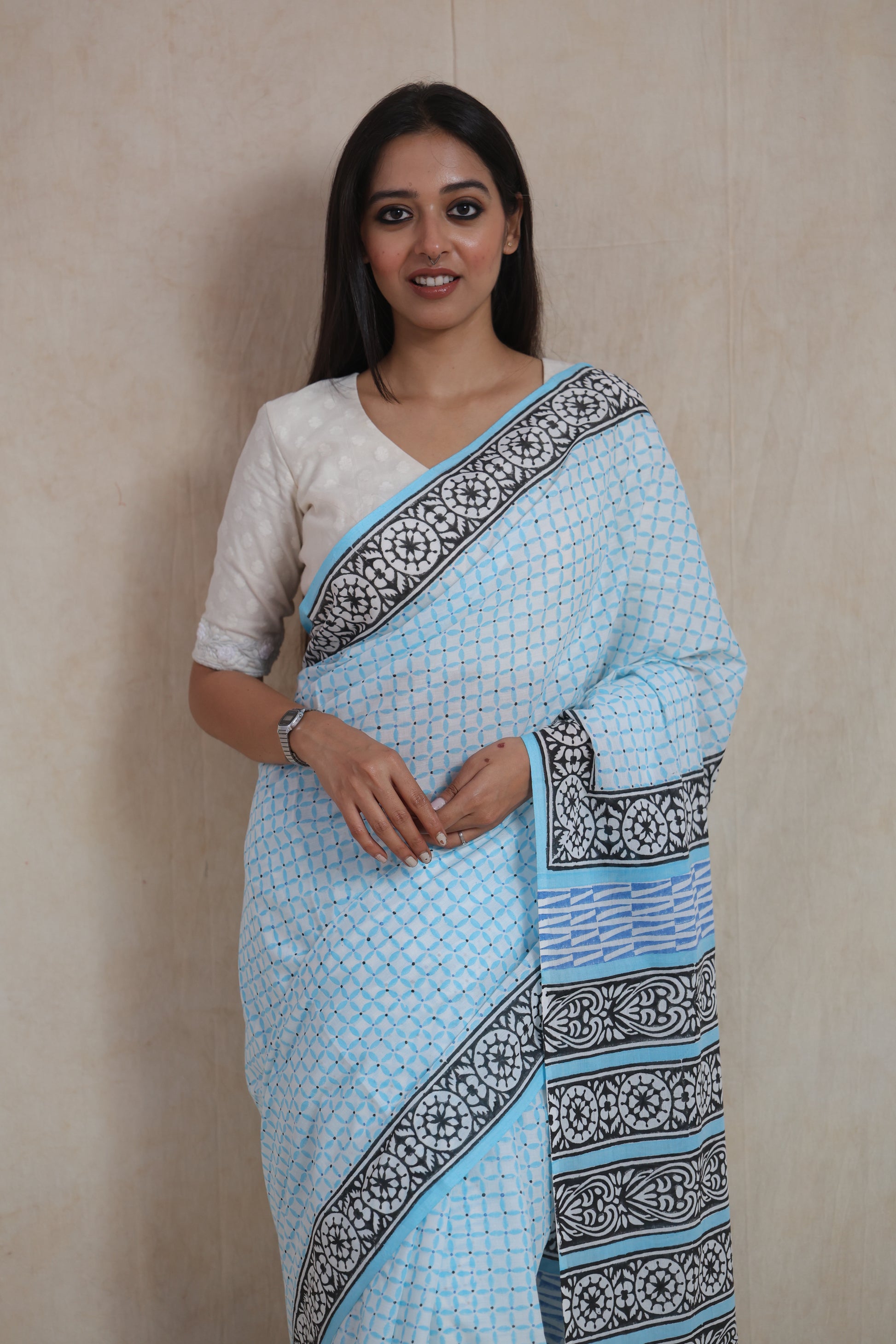 Front look of sky blue Sanghnaree cotton saree with traditional prints