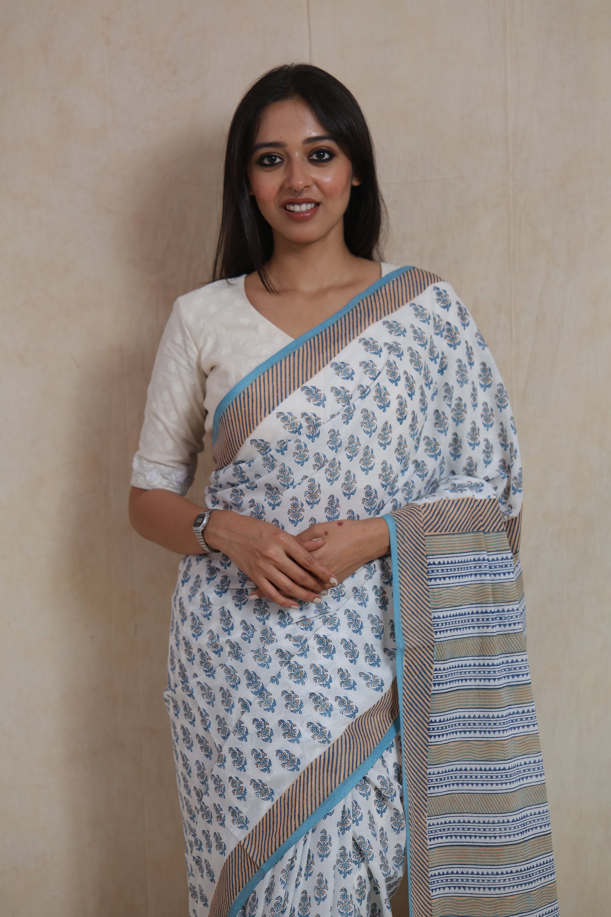 Front view of white Sanghnaree cotton saree with striped pallu