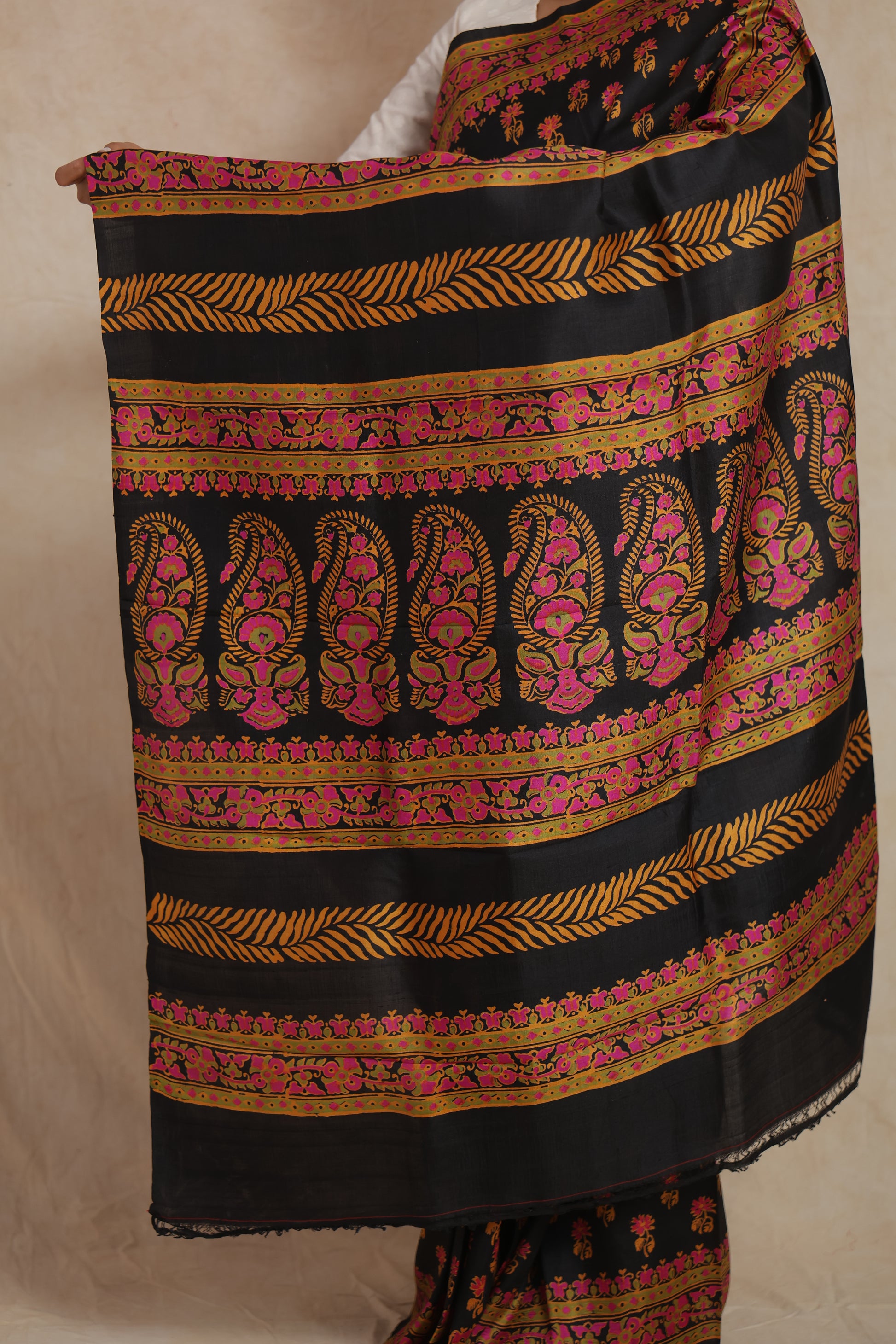 Elegant black Batik silk saree with vibrant traditional printed patterns