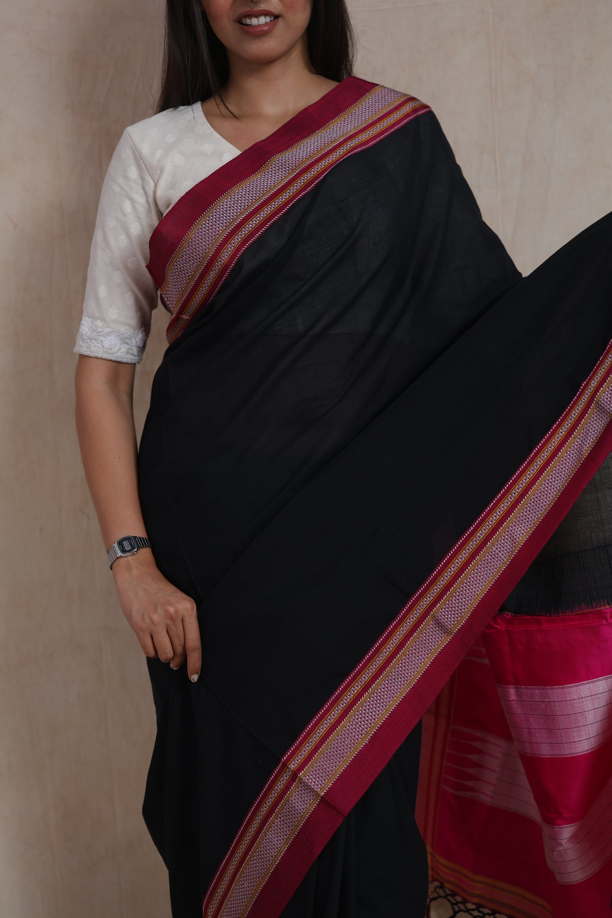 Portrait view of handwoven black Ilkal cotton saree