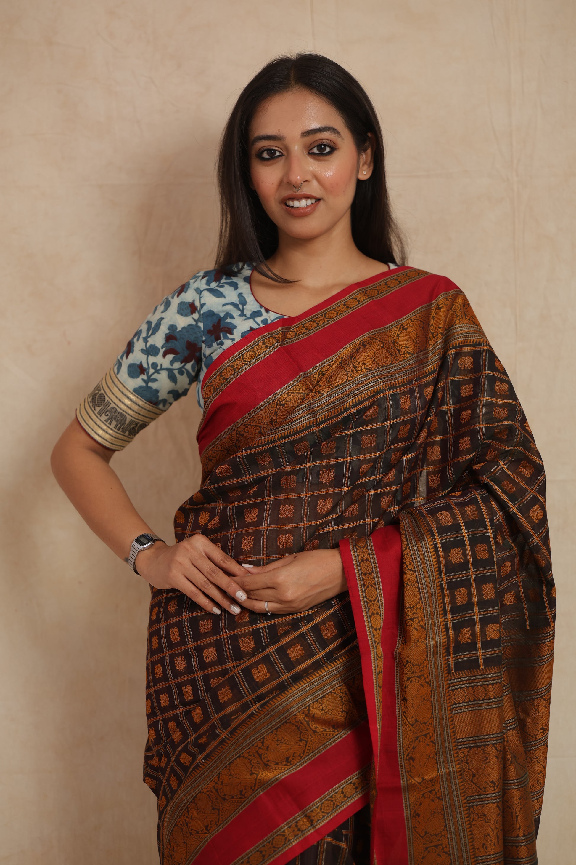 Front portrait of black Kanchipuram cotton saree with crimson red border