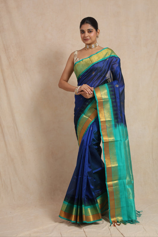 Full look of royal blue Kanchipuram Sico saree with woven buttas and zari border