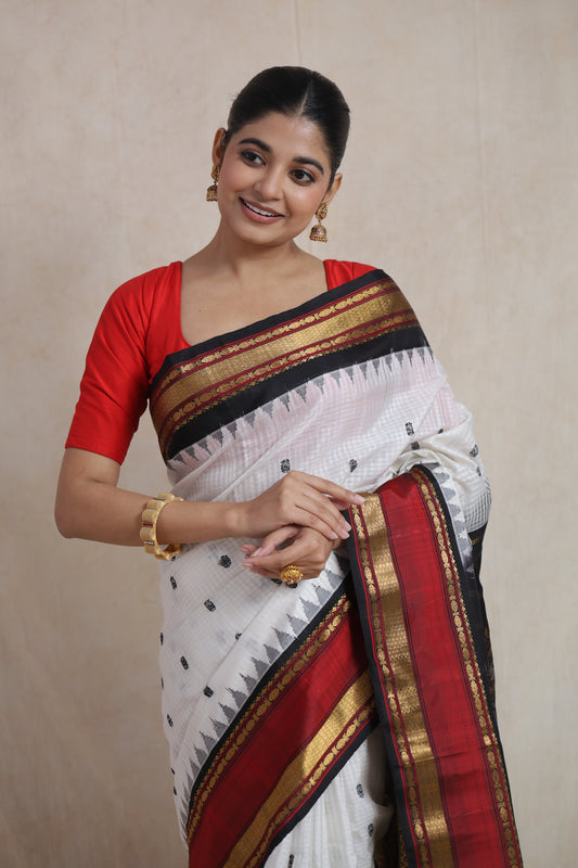 Elegant Gadwal silk saree featuring delicate woven buttas