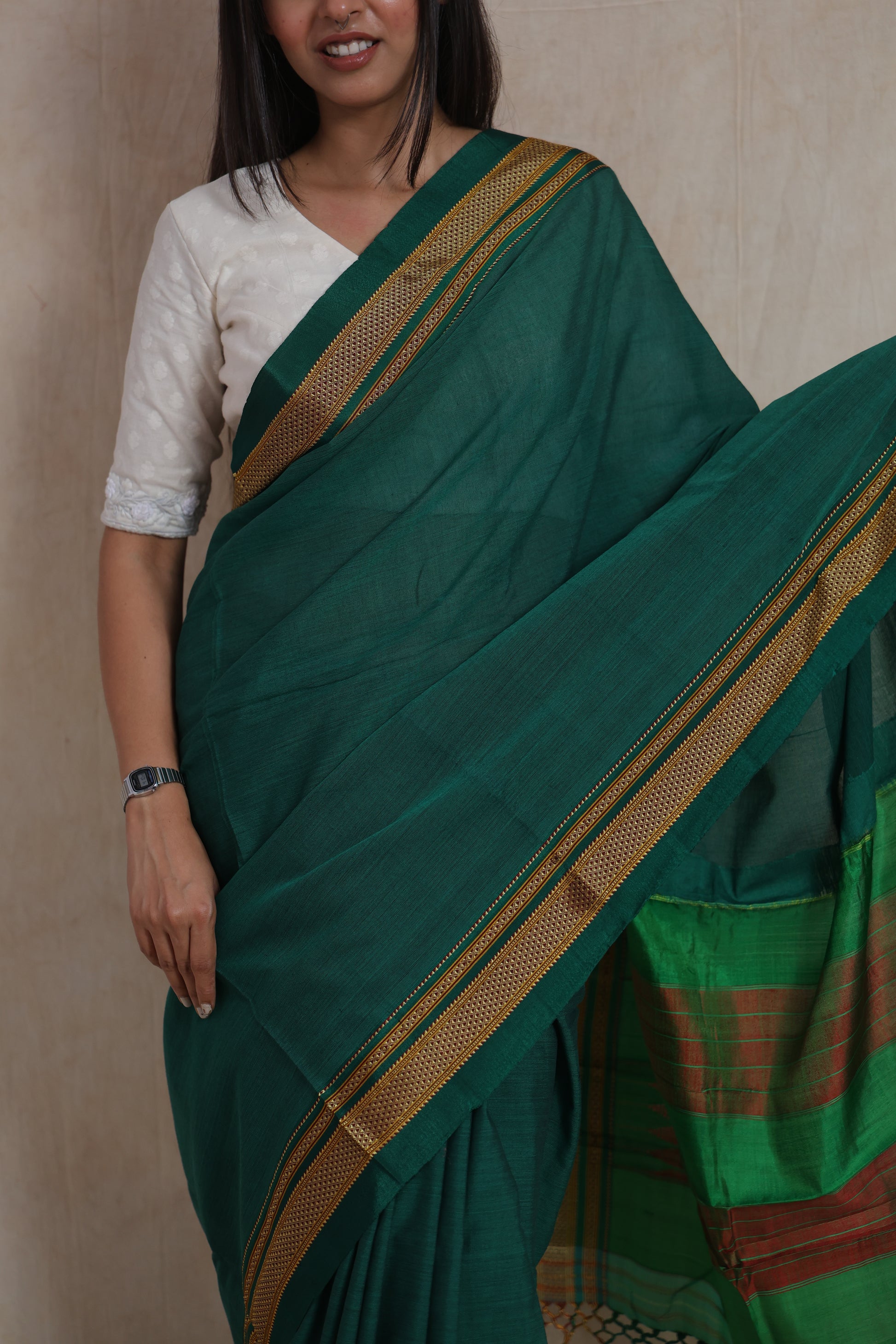 Portrait view of handwoven emerald green Ilkal cotton saree