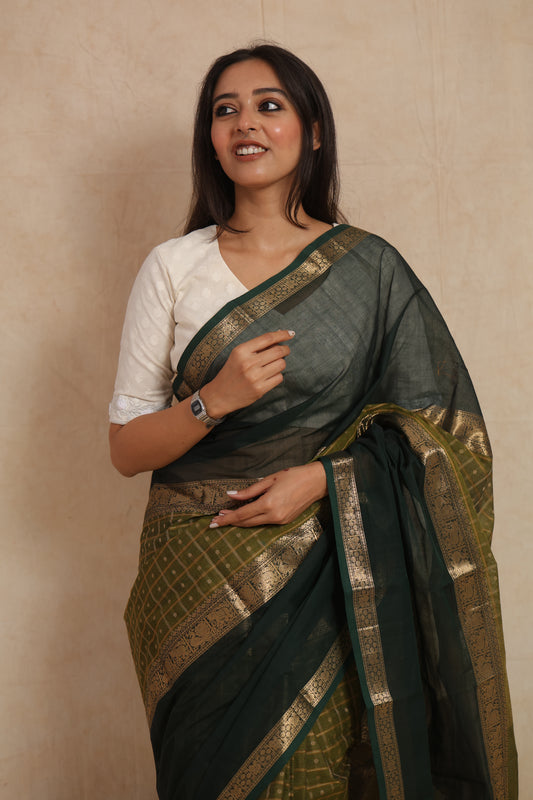 Elegant deep green Kanchipuram handloom cotton saree with traditional woven detailing