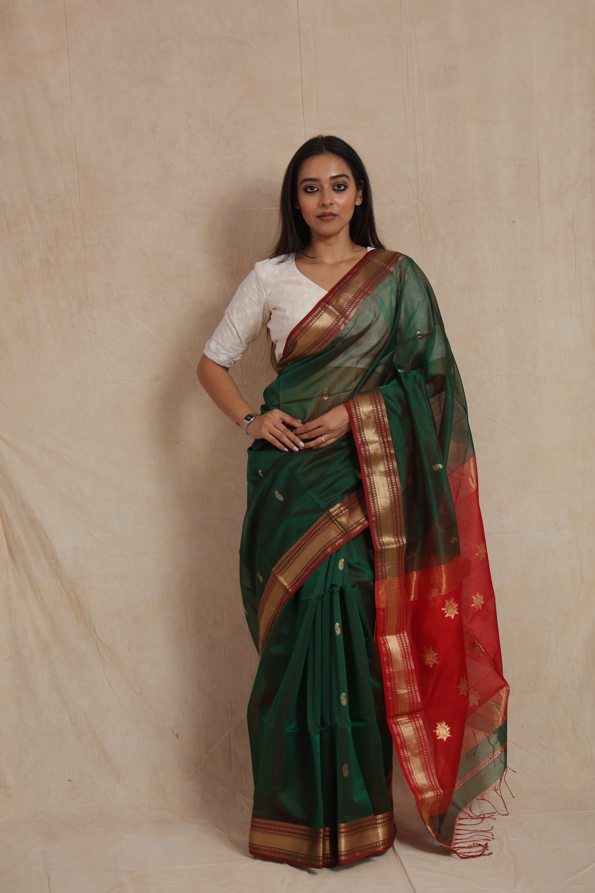 Full front view of bottle green Maheshwari handloom silk cotton saree with traditional woven border