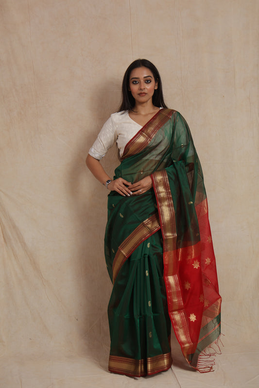 Full front view of bottle green Maheshwari handloom silk cotton saree with traditional woven border