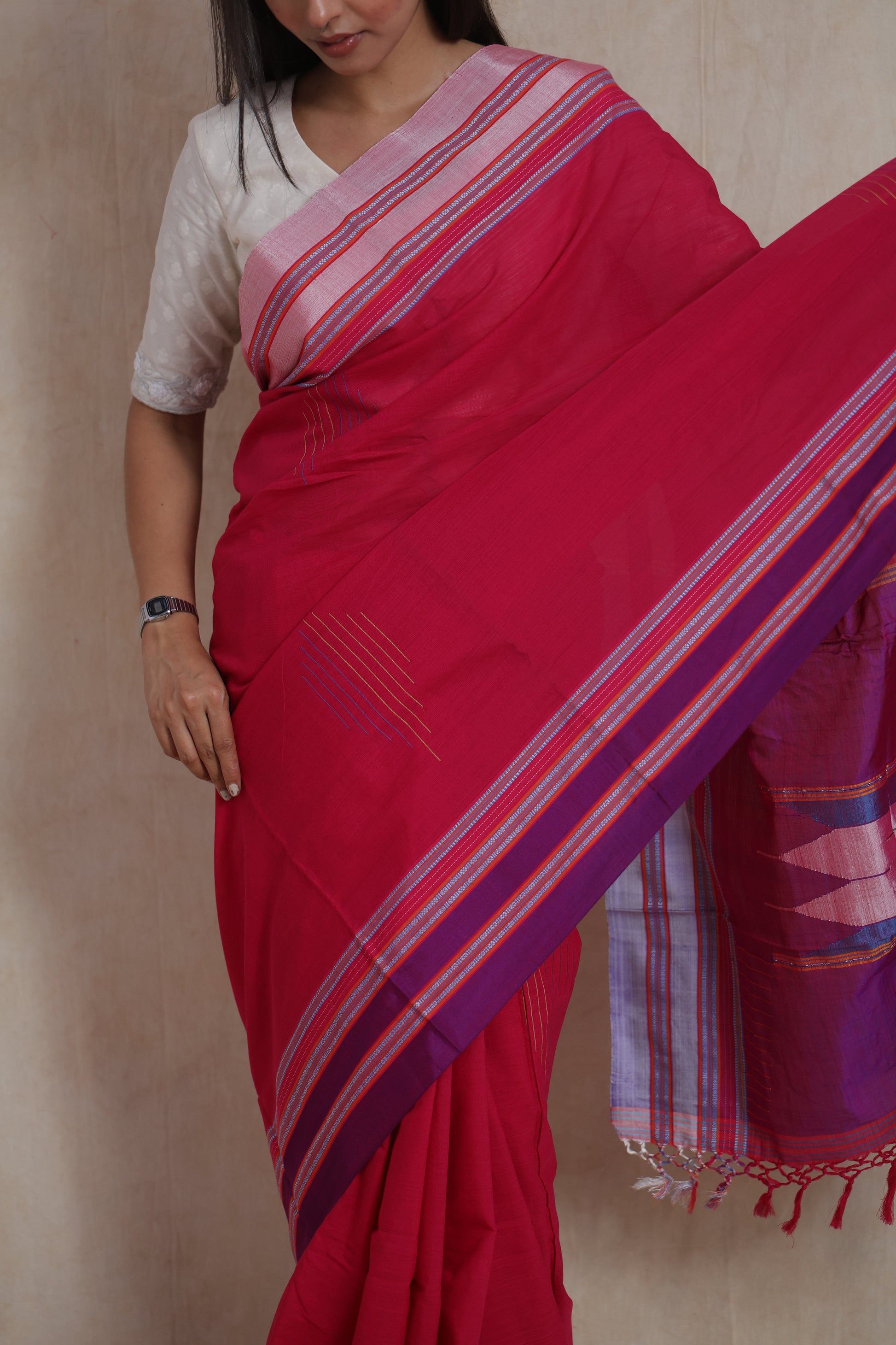 Portrait view of handwoven rani pink Ilkal saree with contrast border
