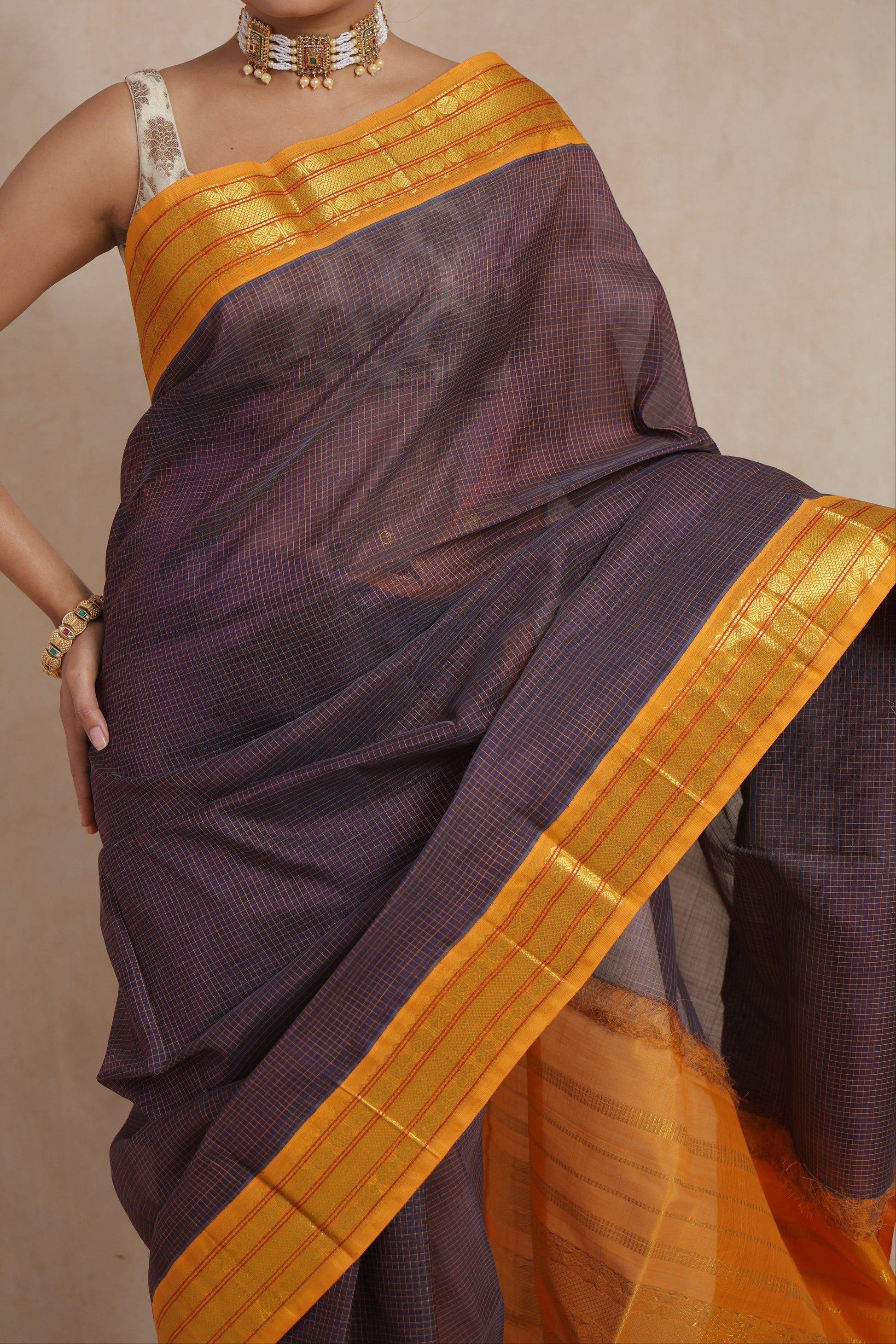 Front look of elegant indigo Kanchipuram Sico saree with mustard gold border