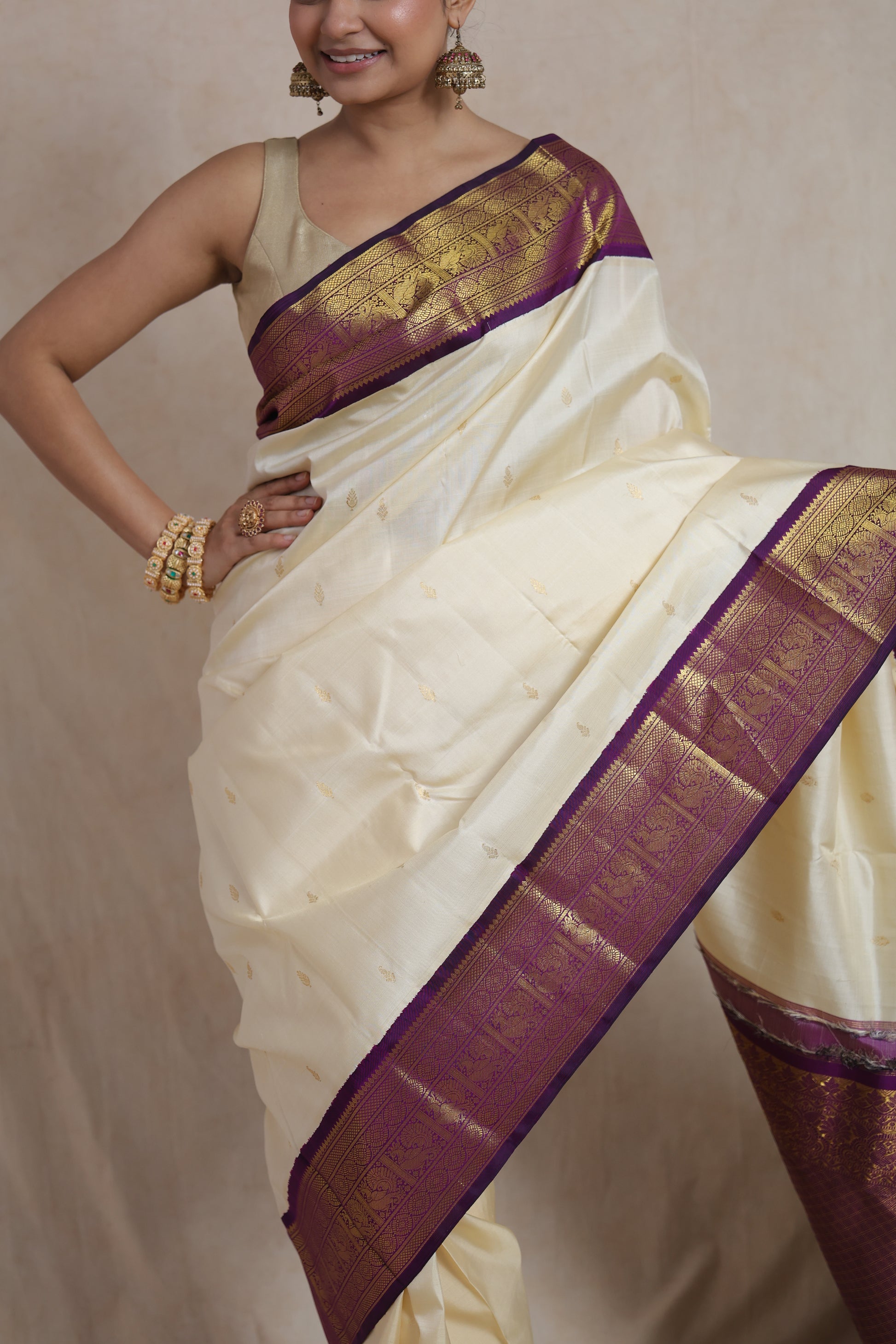 Elegant ivory and purple Kanchipuram silk saree for festive occasions