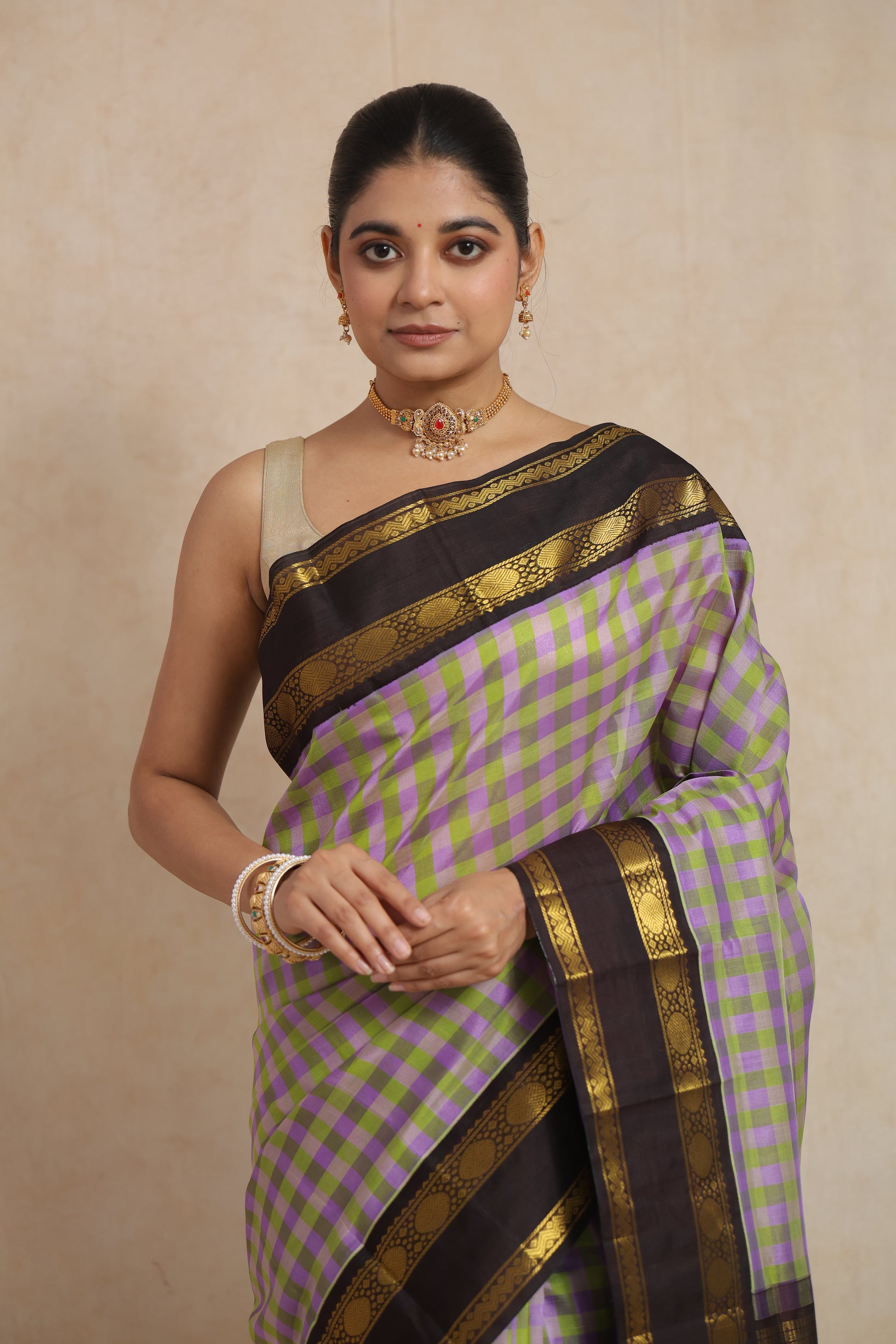 Full look of lavender and olive green Kanchipuram Sico saree with woven border