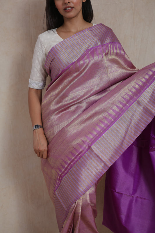 Portrait view of lavender Kanjivaram silk saree with traditional zari detailing