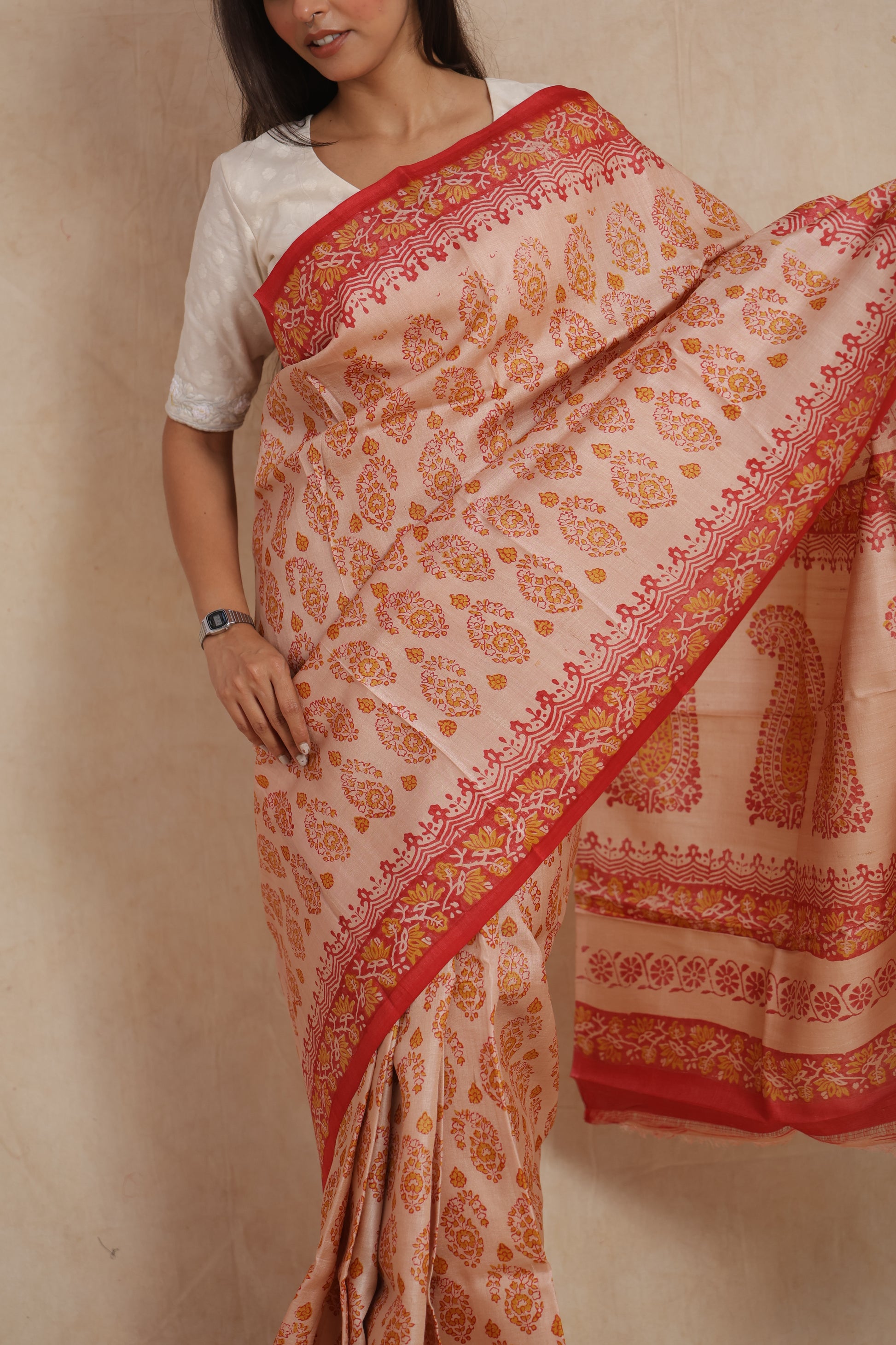 Elegant blush pink Batik silk saree with artistic border and delicate printed motifs