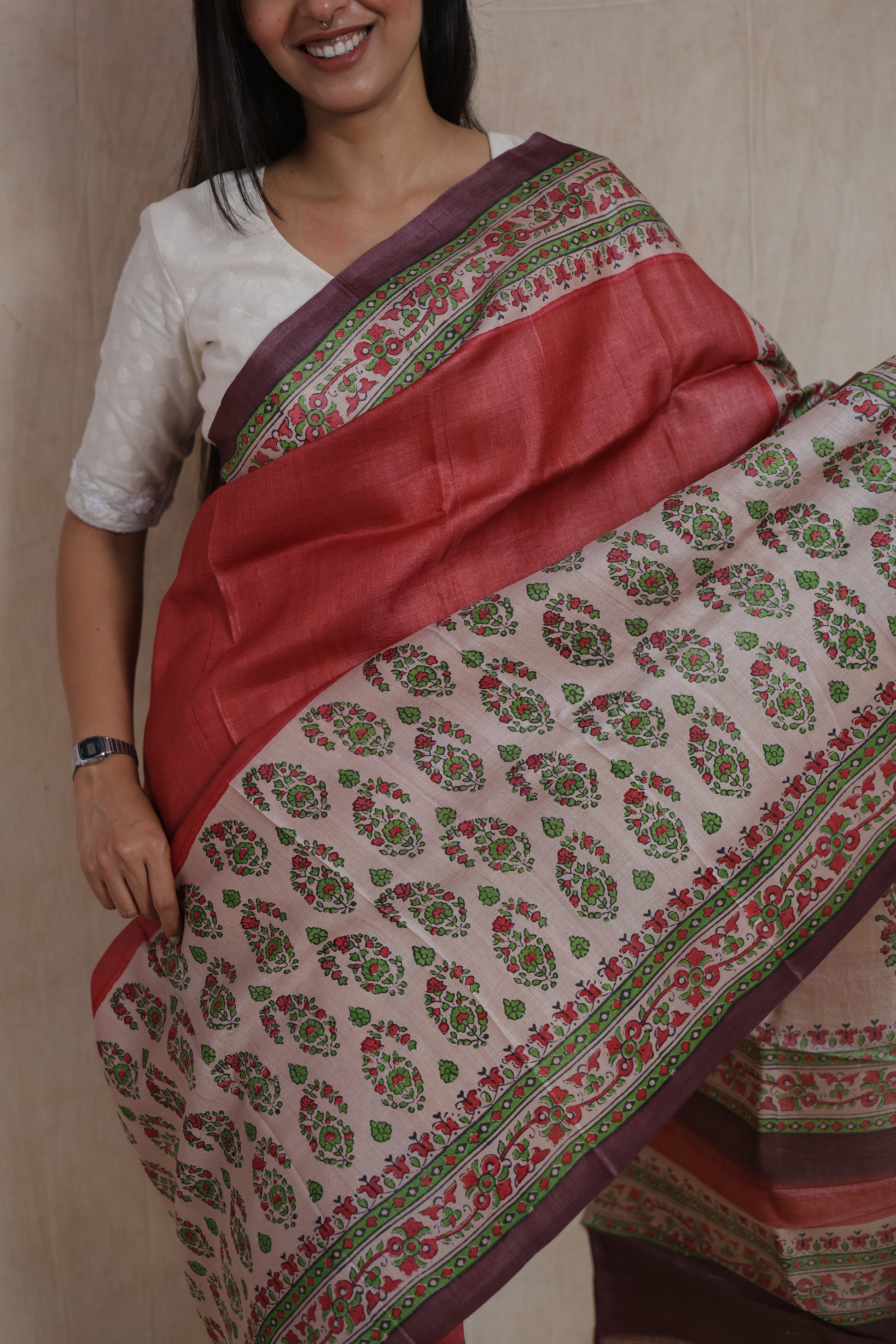 Portrait styling of rust rose Tussar print saree with artistic borders