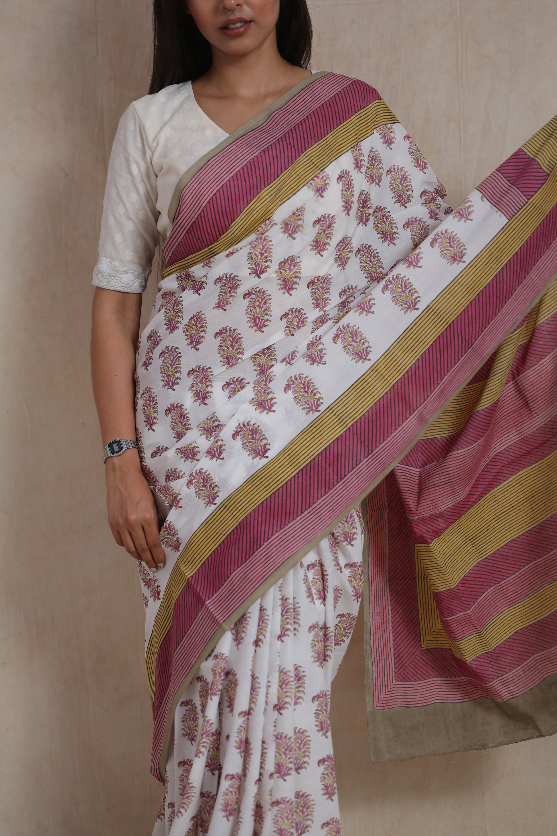 Front view of white Sanghnaree cotton saree with pink and mustard striped pallu