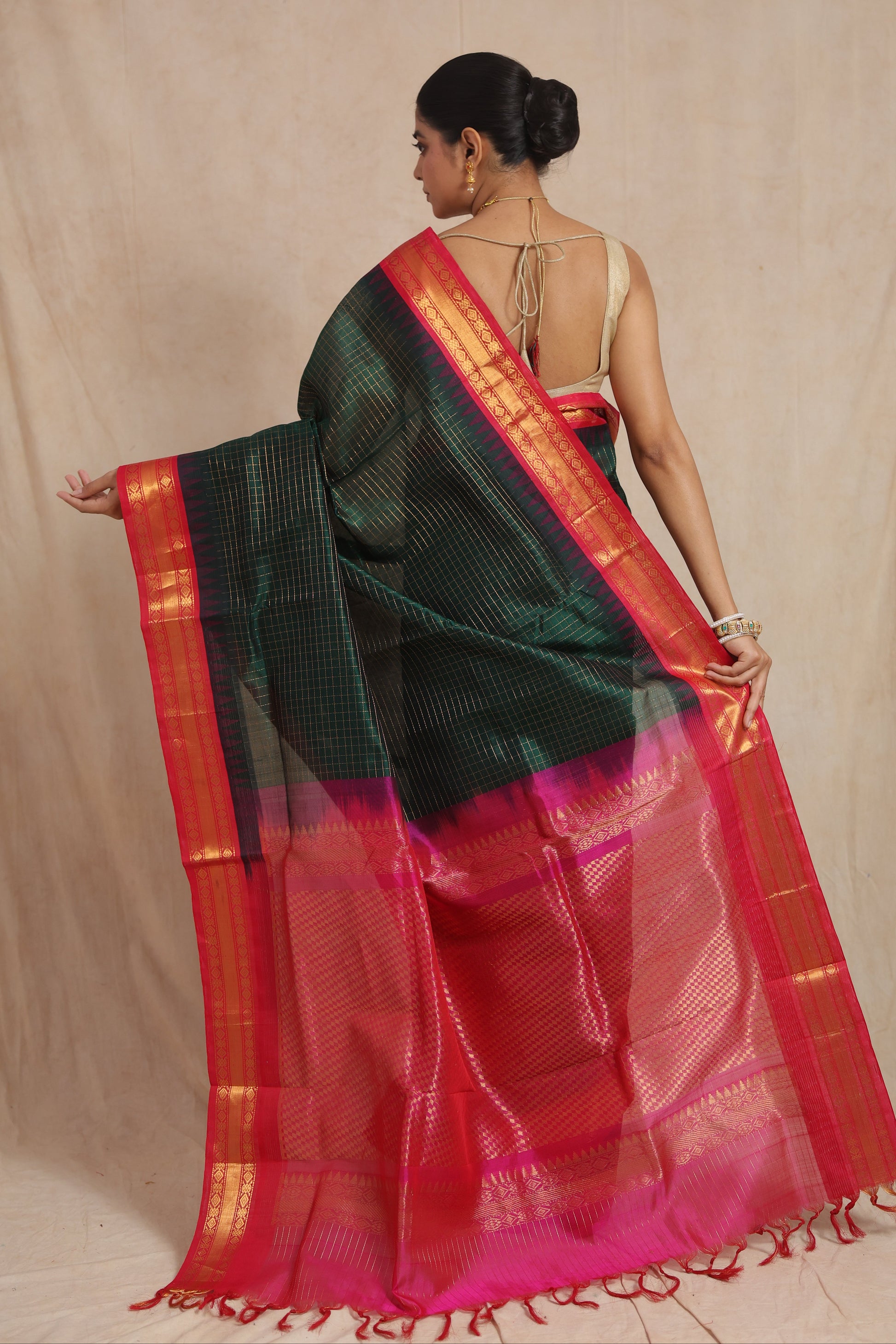 Back view of emerald green Kanchipuram Sico saree with woven pallu