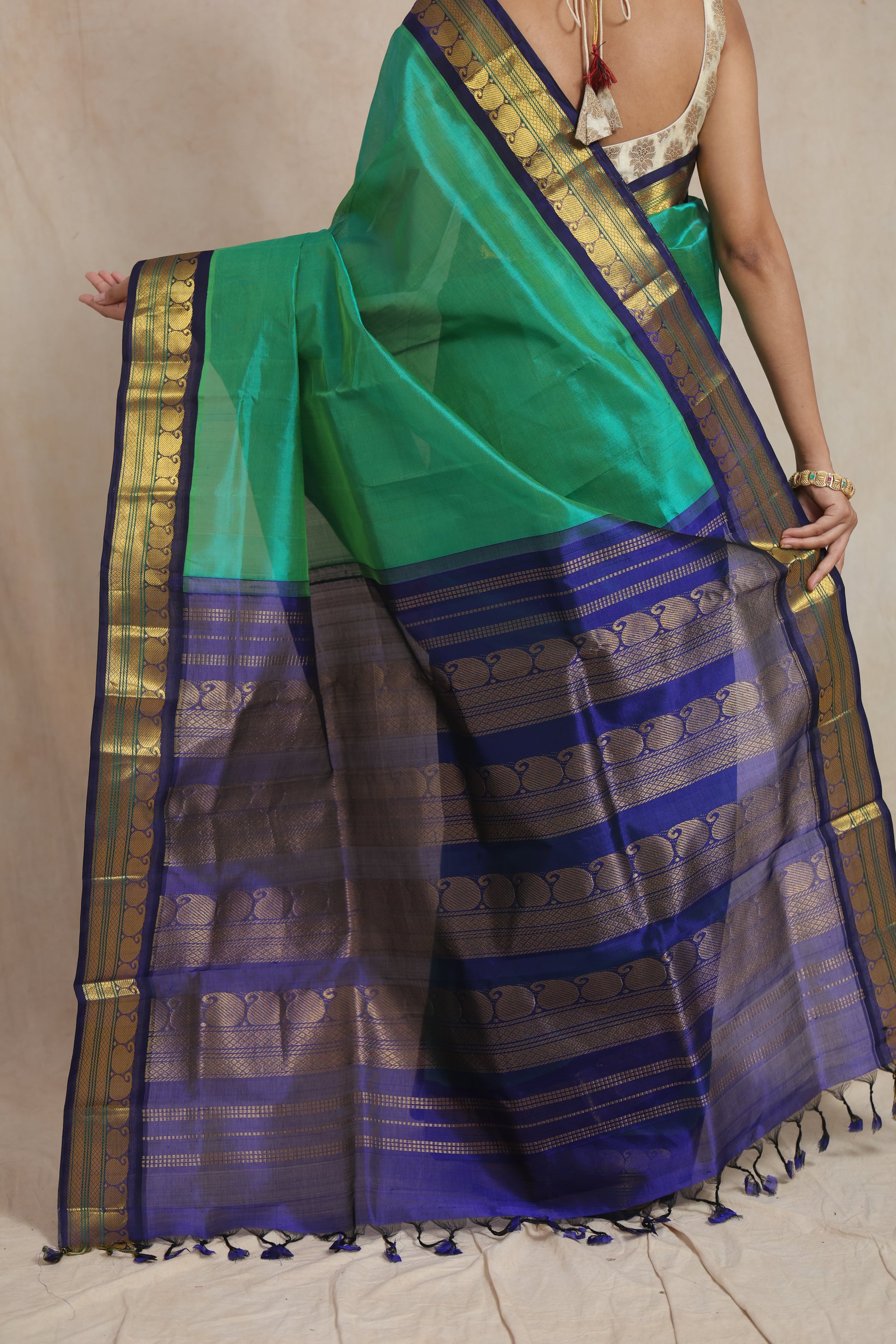 tyled look of emerald green Kanchipuram Sico saree with rich woven pallu