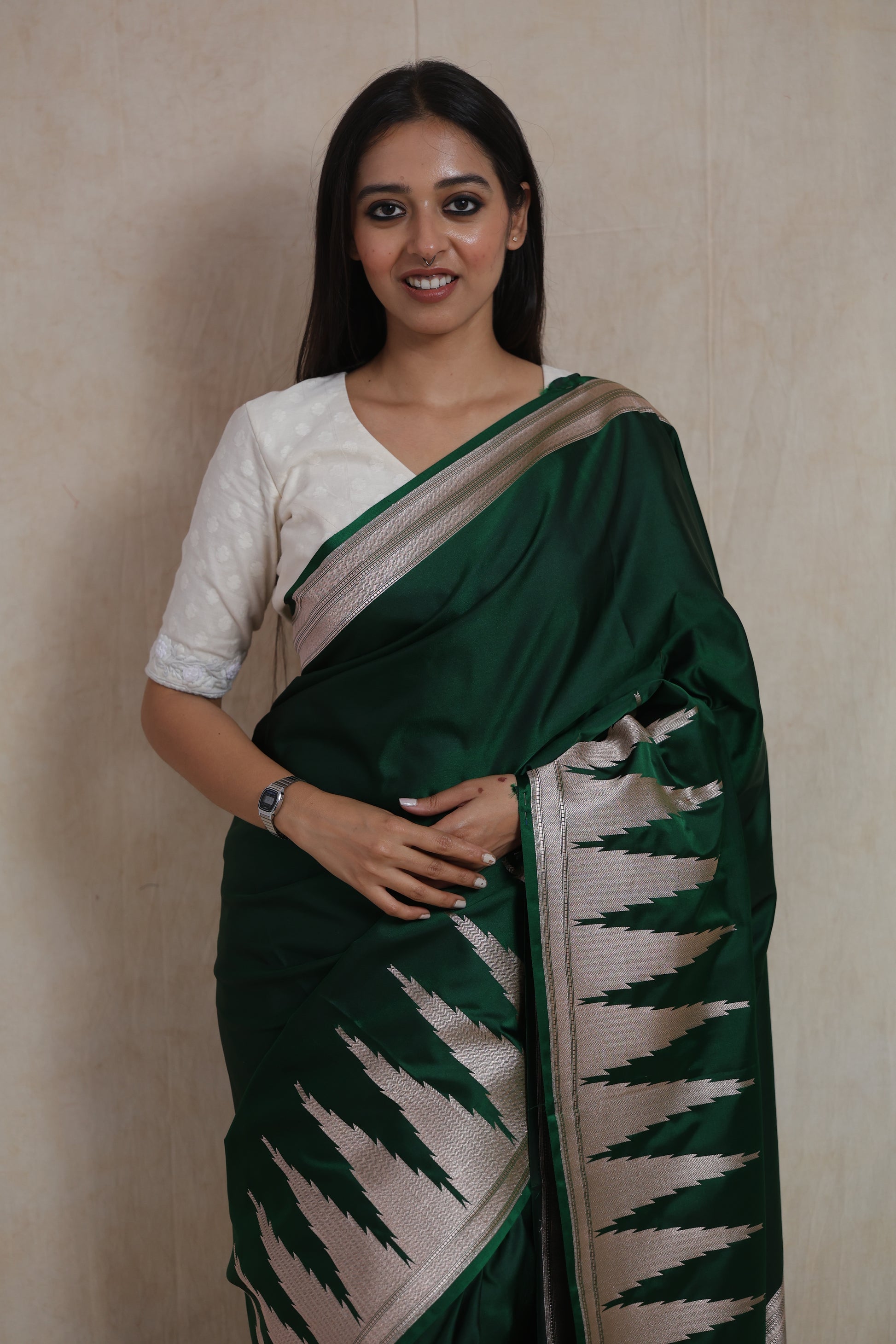 Portrait view of emerald green Banarasi art silk saree with elegant silver woven detailing