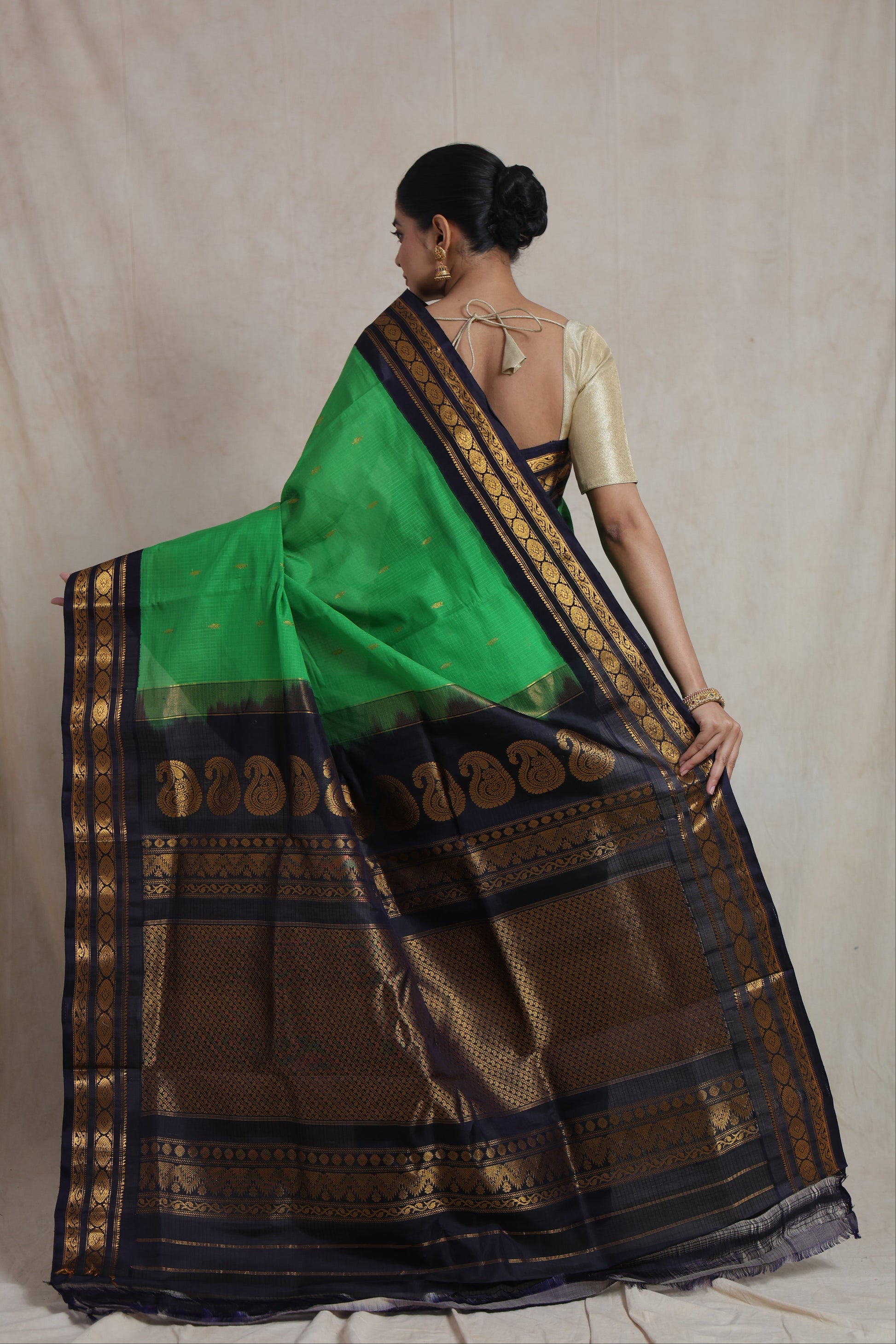 Back view of emerald green Gadwal Sico saree with rich woven pallu