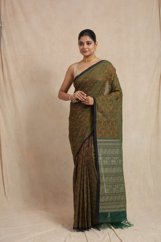 Classic pose in emerald green Kanchipuram cotton saree