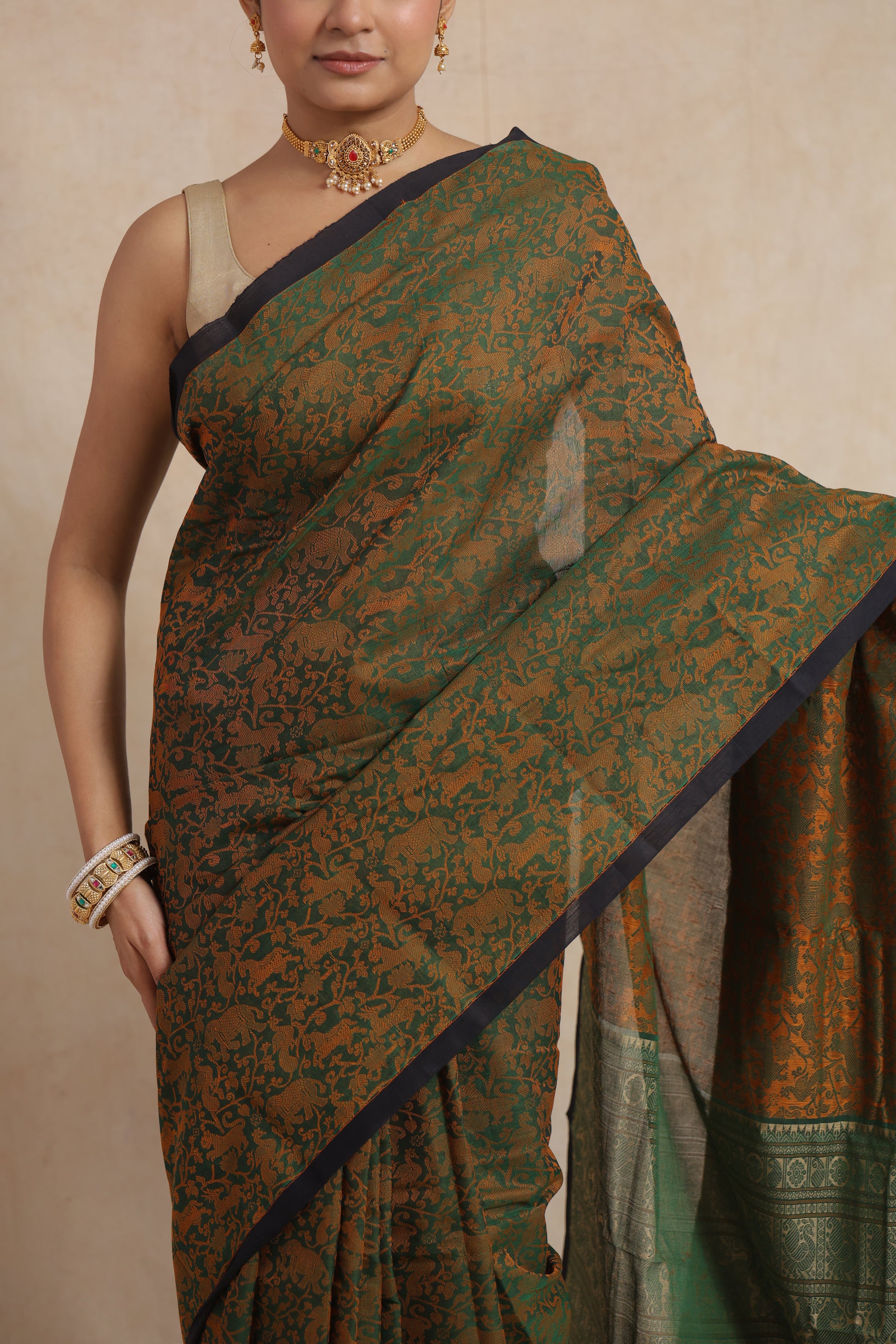 Close-up of woven motifs on green Kanchipuram cotton saree