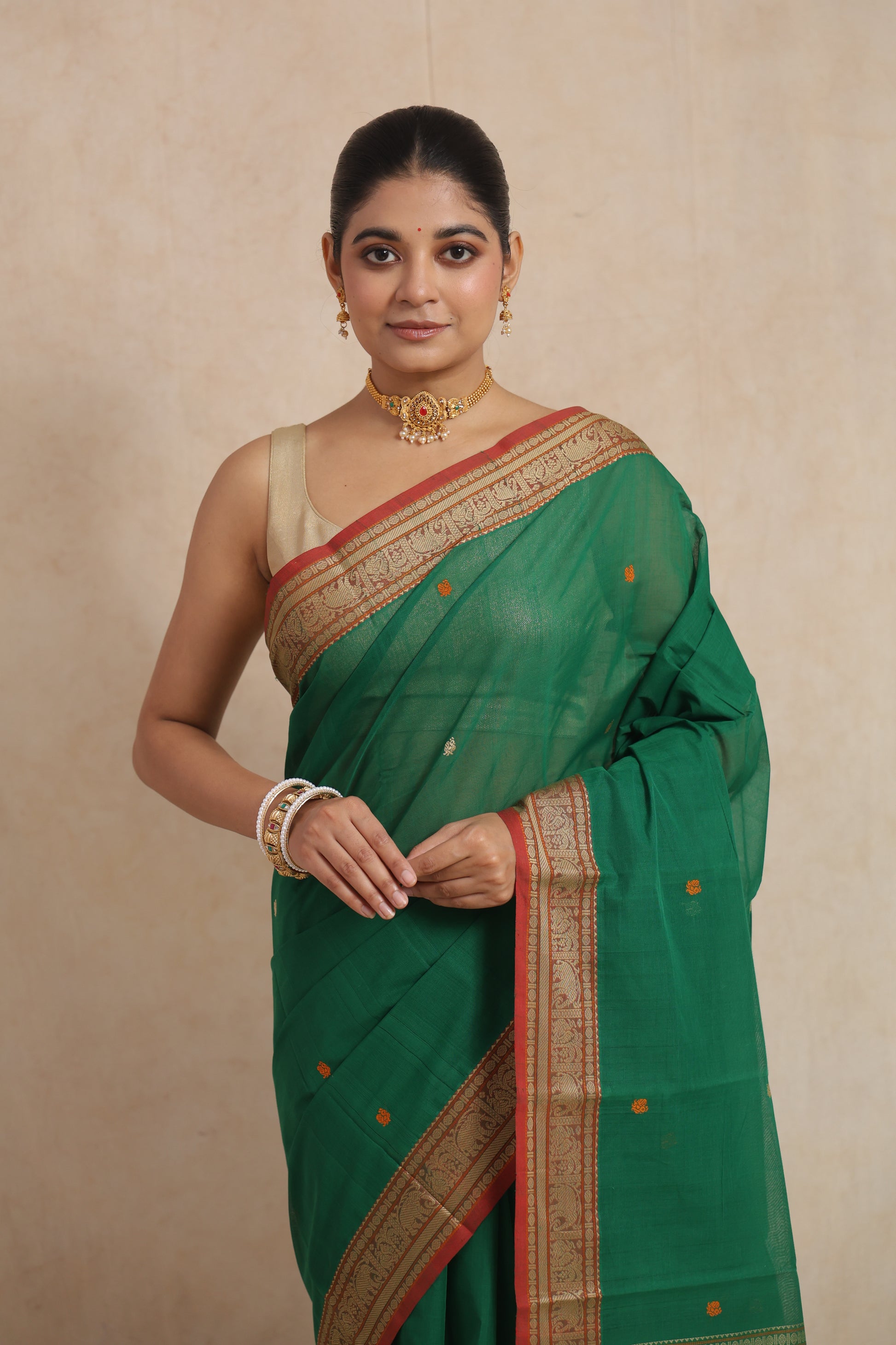 Close-up view of emerald green Kanchipuram cotton saree