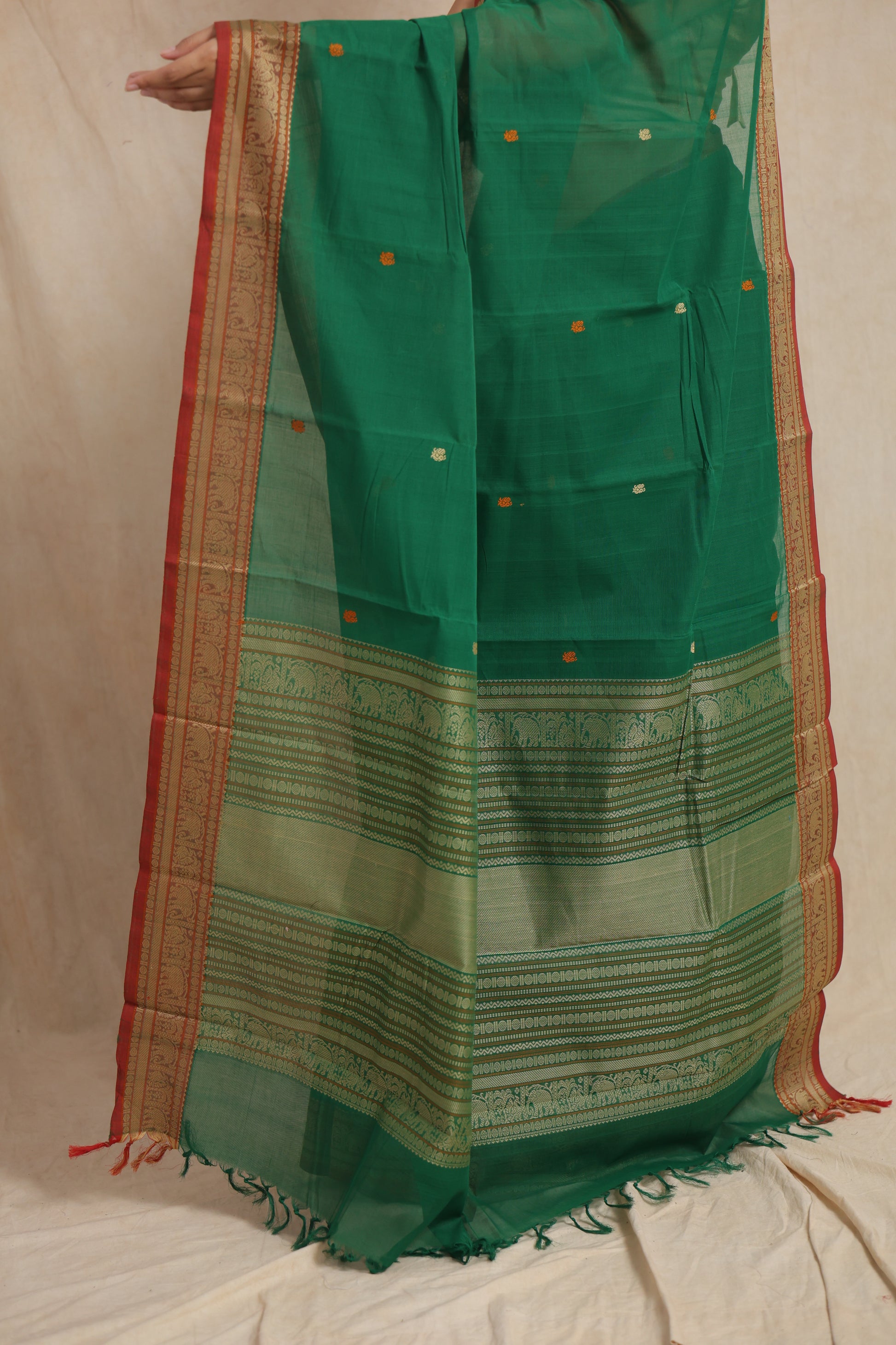 Close-up of woven pallu on emerald green Kanchipuram cotton saree