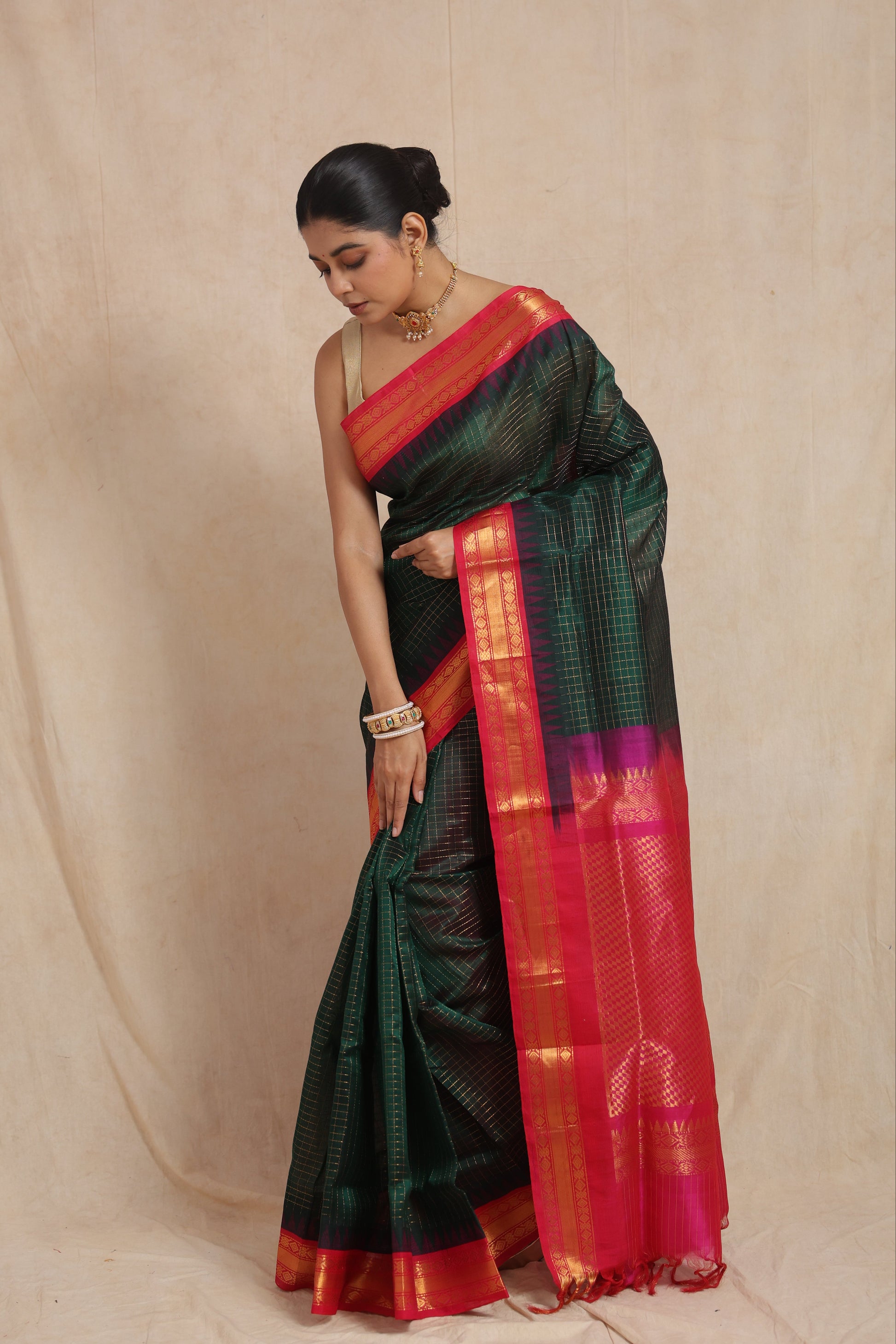 Elegant look of green Kanchipuram Sico saree with contrast border